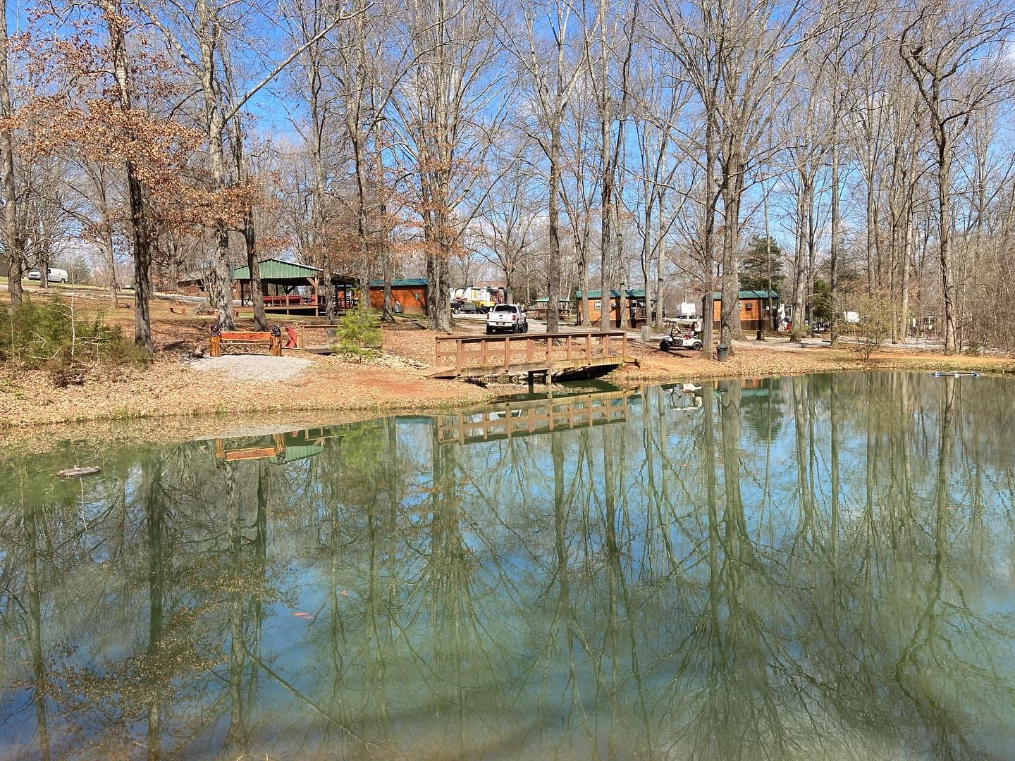 The Sweetwater KOA offers a serene escape with a beautiful lake, cozy cabins nestled amidst the surrounding trees.