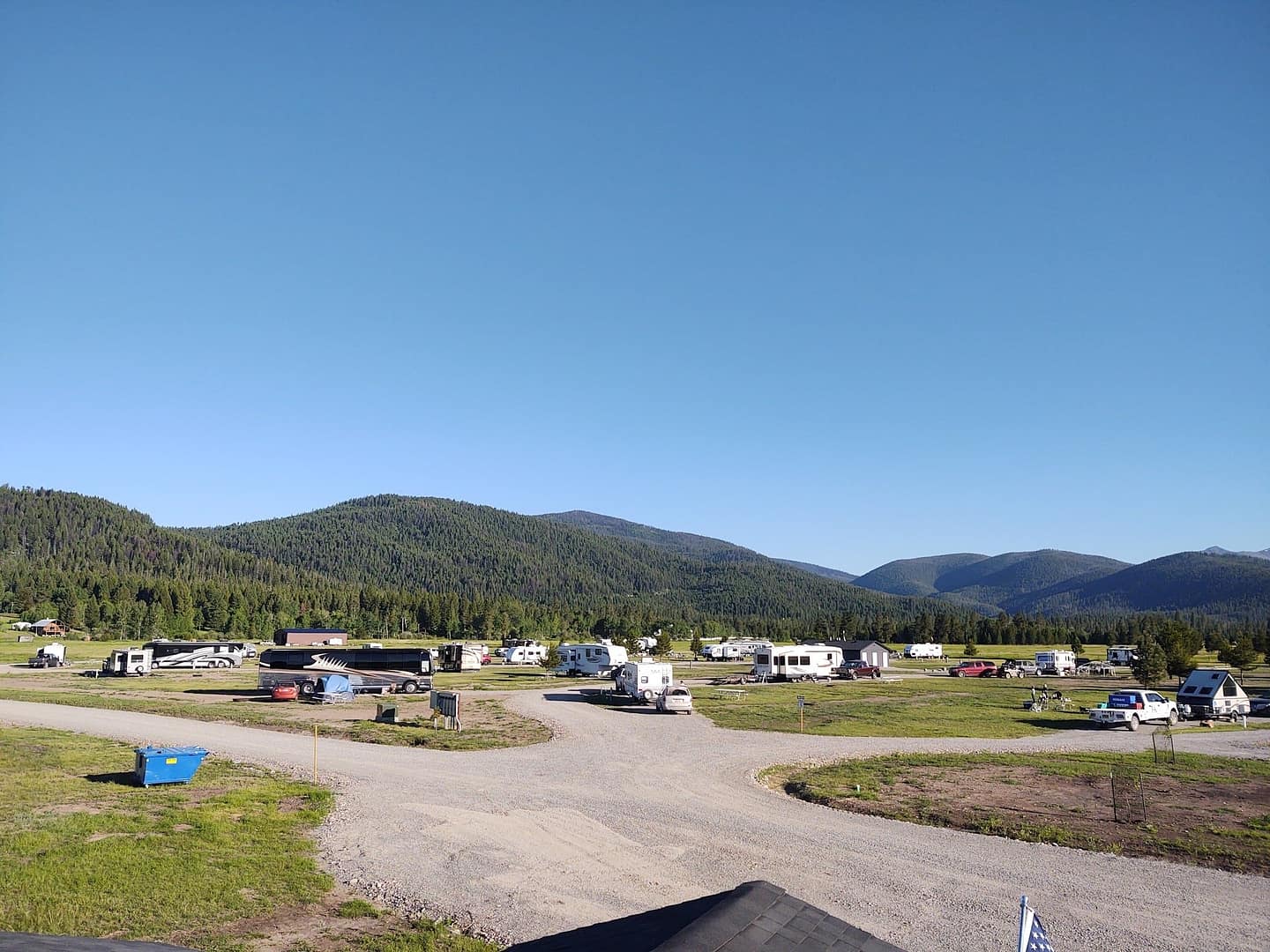 Lost Moose Meadows, a couple's dream RV park nestled among the picturesque Nevada mountains, boasts an abundance of parked RVs against a stunning mountainous backdrop.