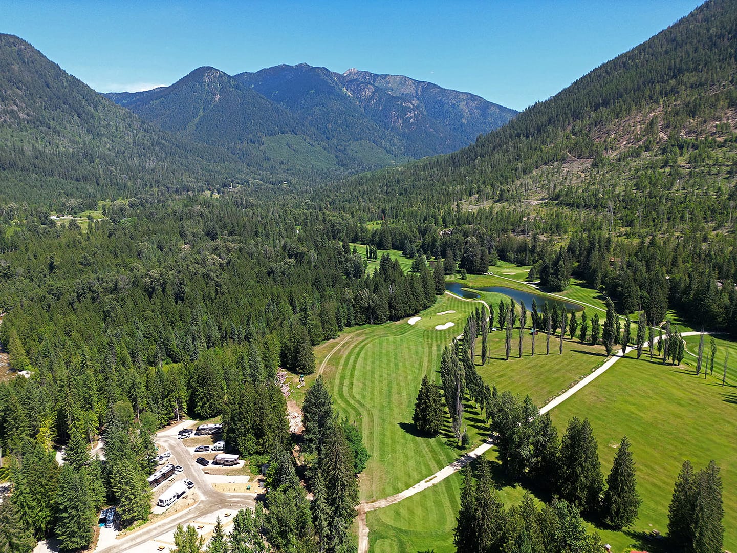An aerial view of a seasonal golf resort in the Columbia Shuswap Regional District mountains.