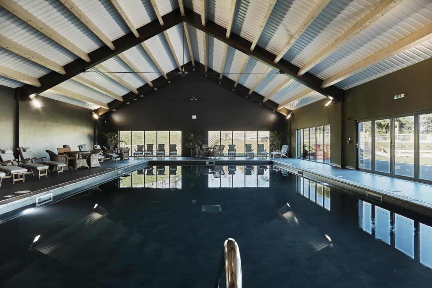 A resort in Wales with an indoor swimming pool in a large building.