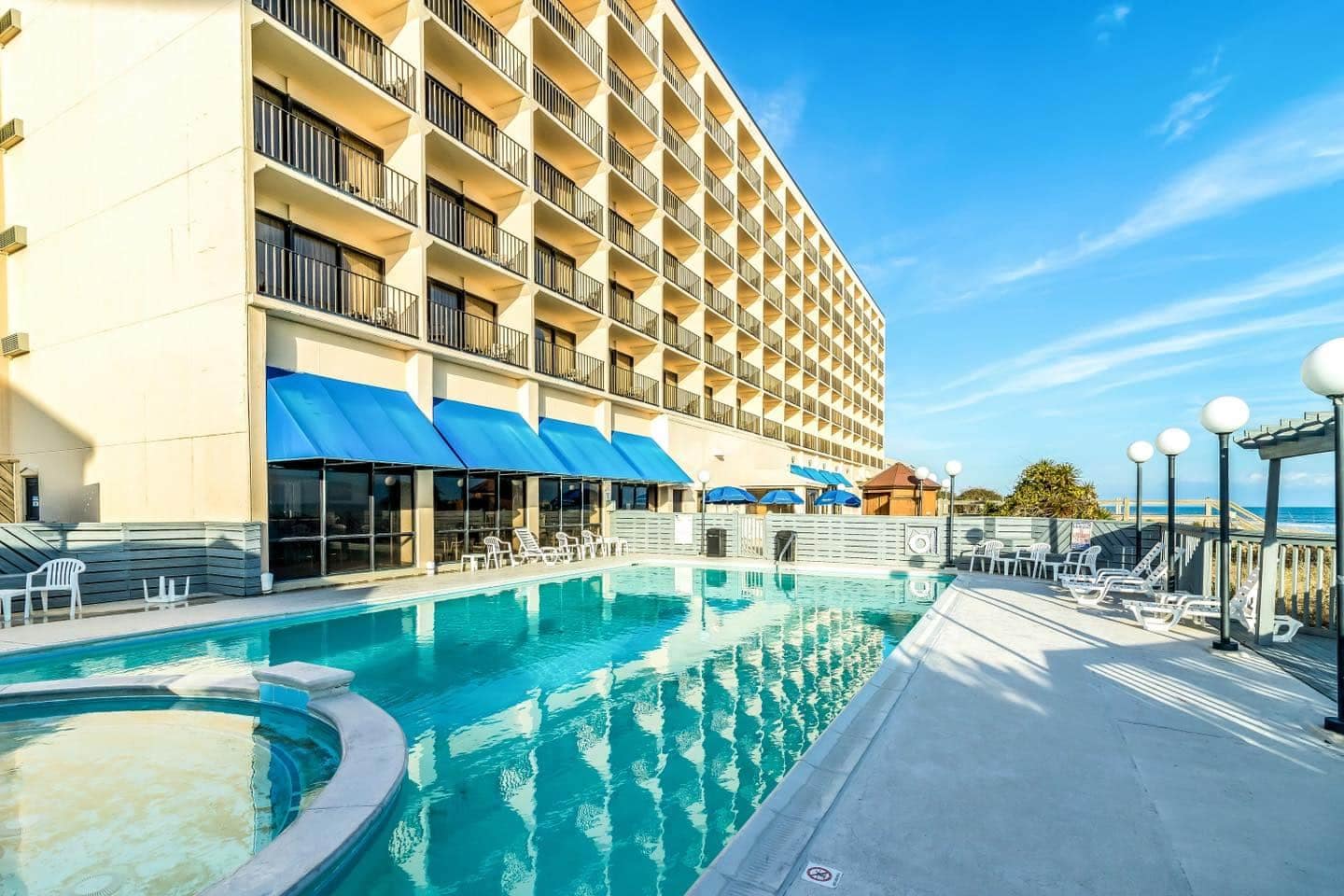 The $2M Inn at Pine Knoll Shores offers a refreshing swimming pool just steps away from the stunning Blue Water ocean views.