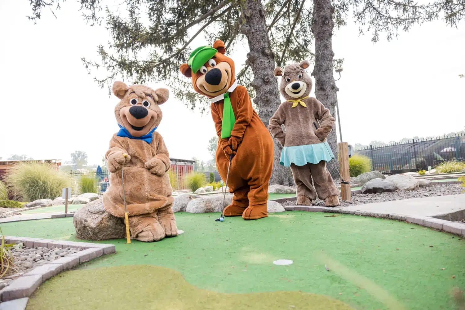 Three bear mascots on a mini golf course at Northgate Resorts, anticipating plans for 2024.