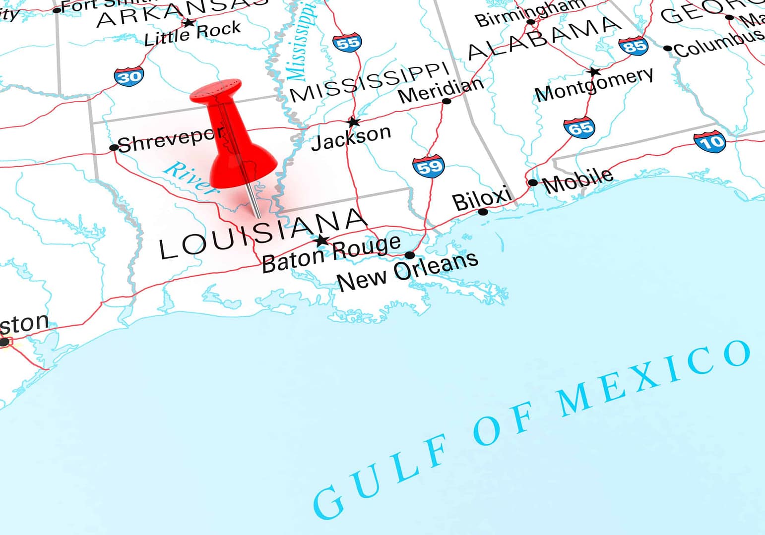 A map focusing on Louisiana State Parks with a red pushpin on Baton Rouge, highlighting its location. The surrounding states and Gulf of Mexico are visible.