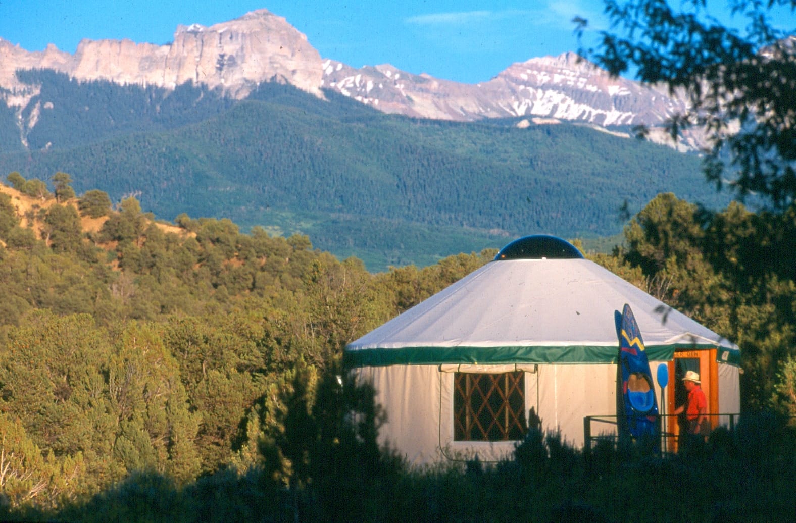 The Colorado Yurt Company prepares a yurt with mountains in the background as Secret Creek rebrands their products.
