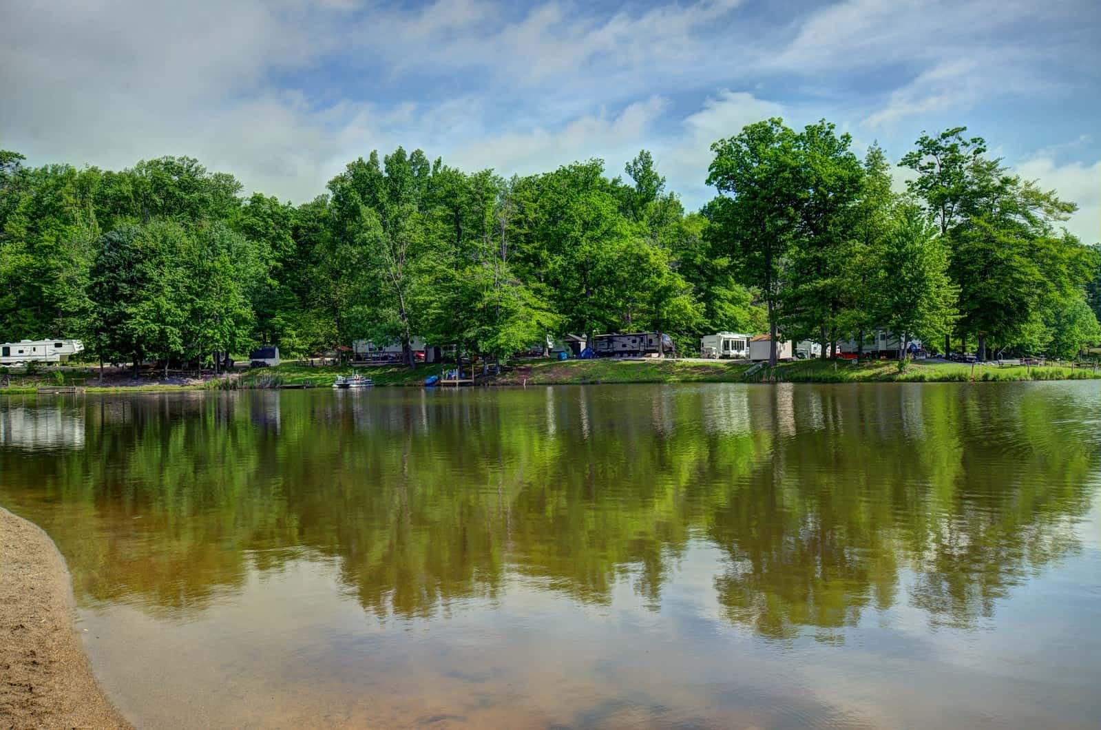Indian Lakes RV Campground offers the perfect setting for a tranquil getaway, with a serene lake nestled amidst lush trees. Ideal for Memorial Day weekend retreats, this campground provides ample opportunities for relaxation