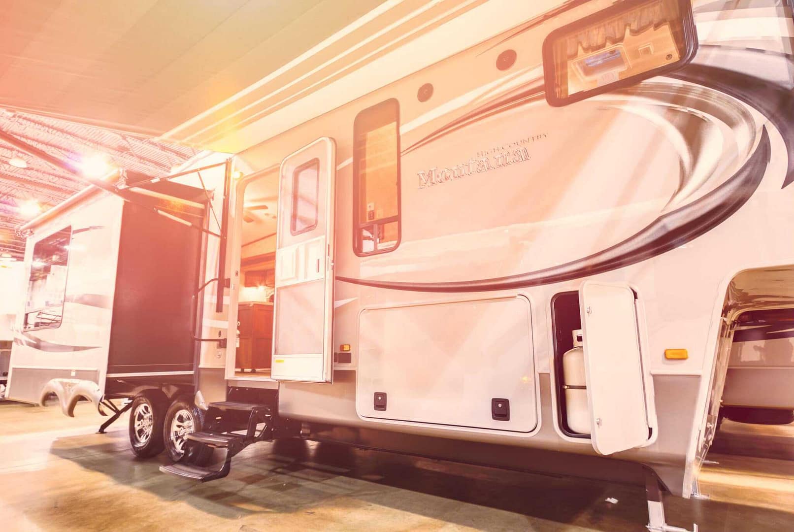 An RV from Toronto is parked in a showroom.
