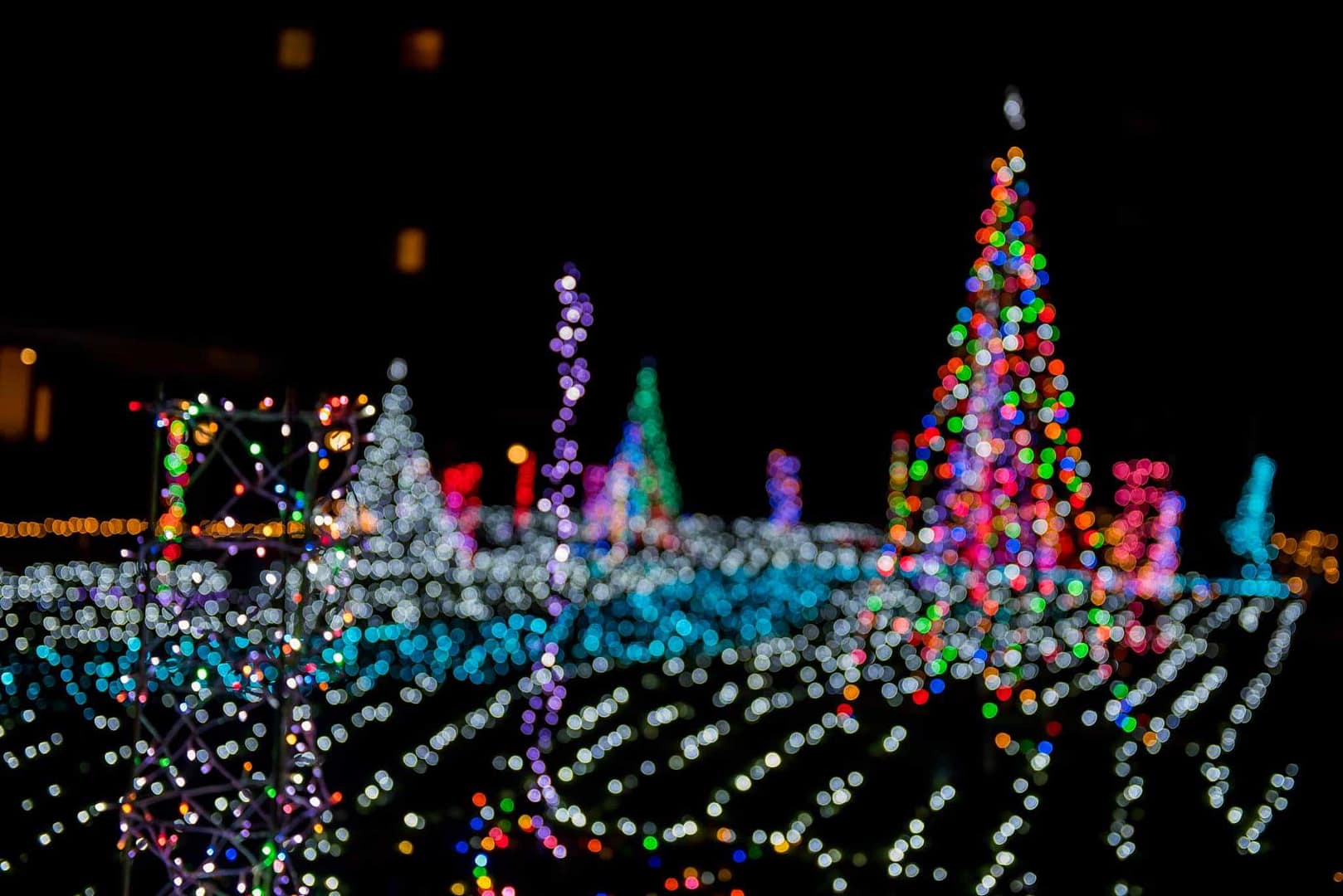 A colorful display of Christmas lights in Augusta West Kampground, creating a Winter Wonderland in Maine's dark area.