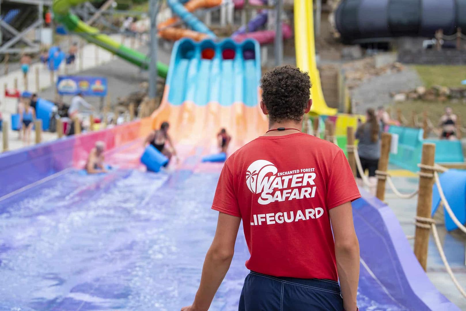 A man acquires a position in front of a water slide at the Water Safari Resort.