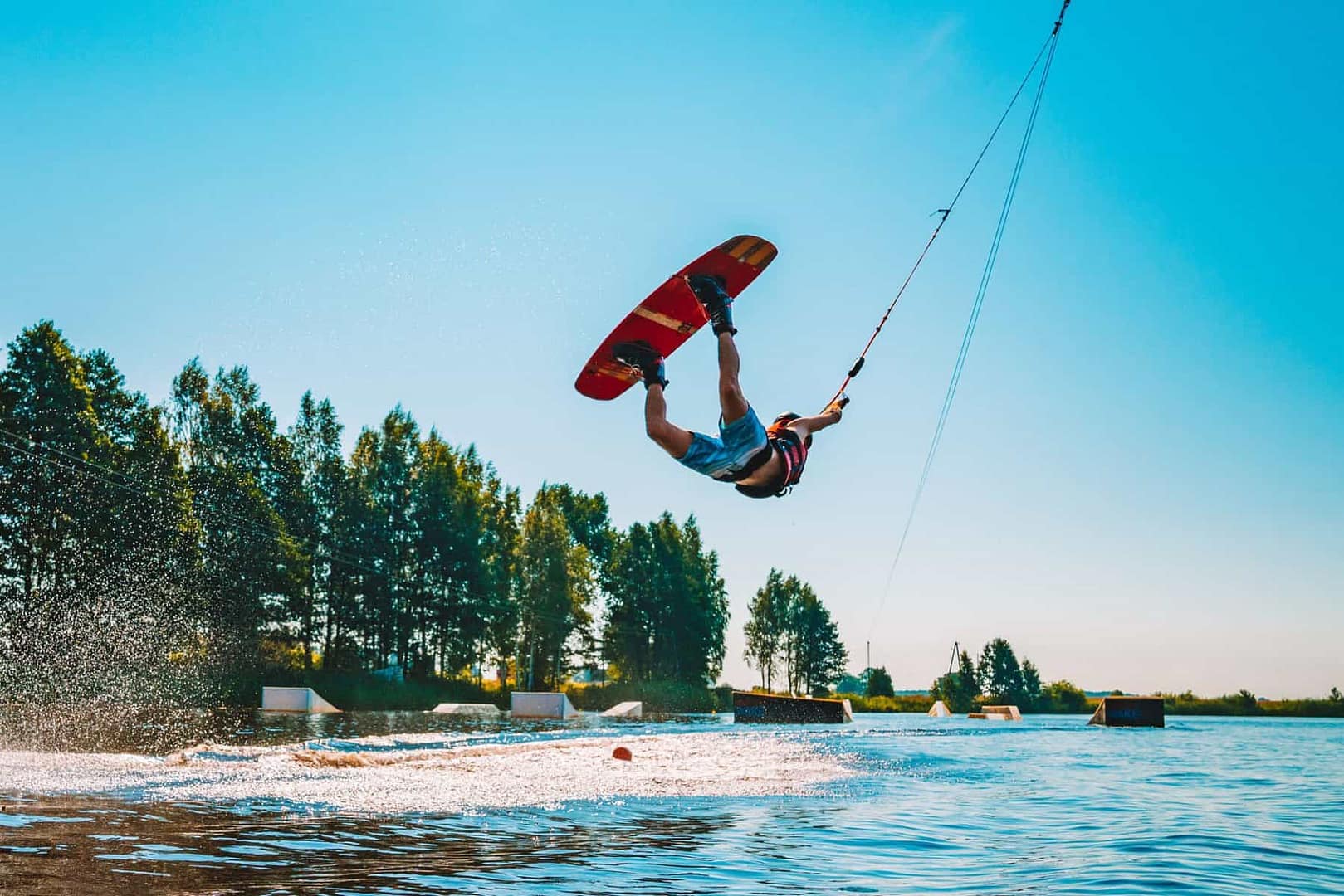 A person ready to ride a wakeboard at an Australian wave park.