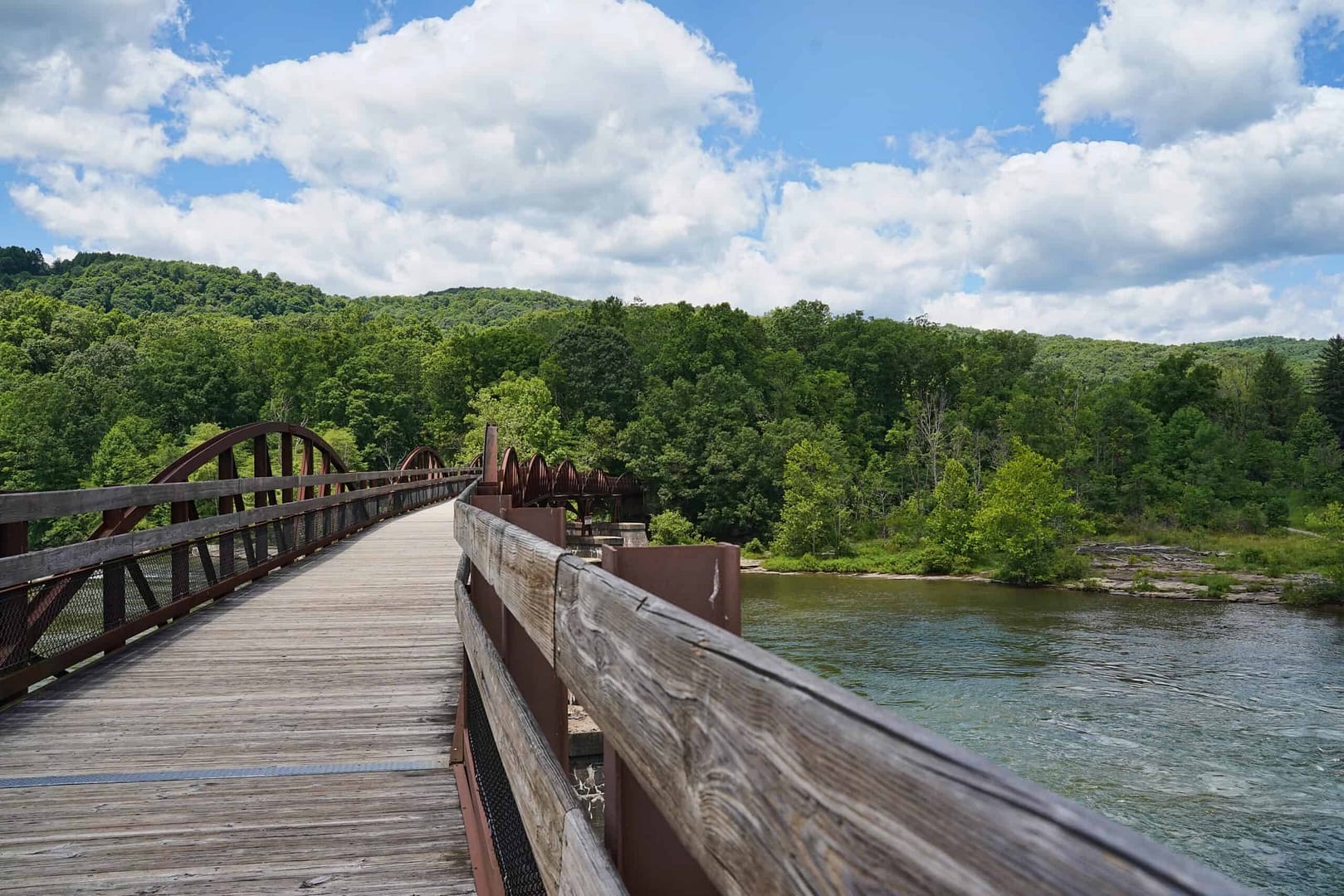 A wooden bridge over a river in one of Pa. State Parks.