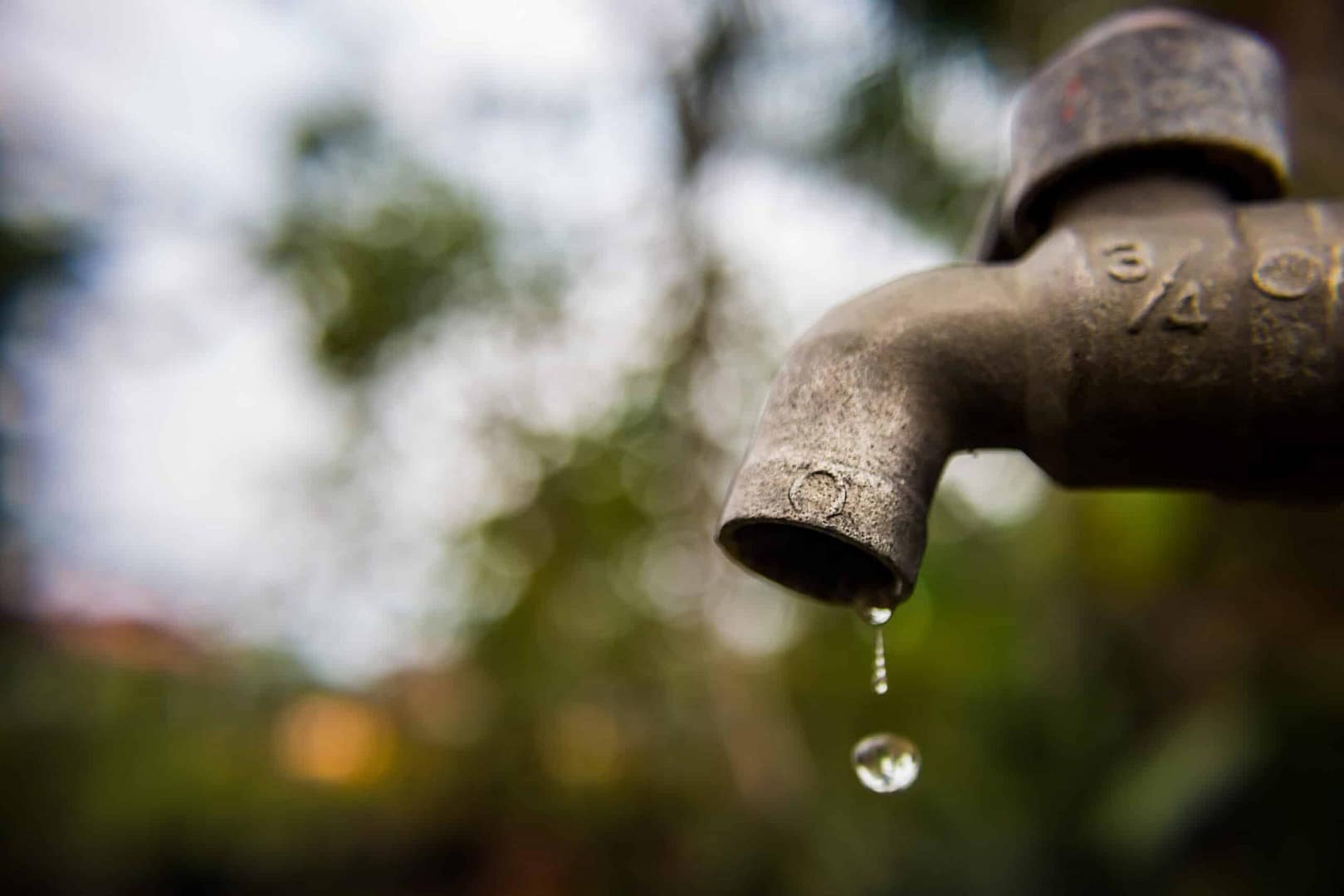 A water faucet at Conchas Lake State Park, with a drop of running water.