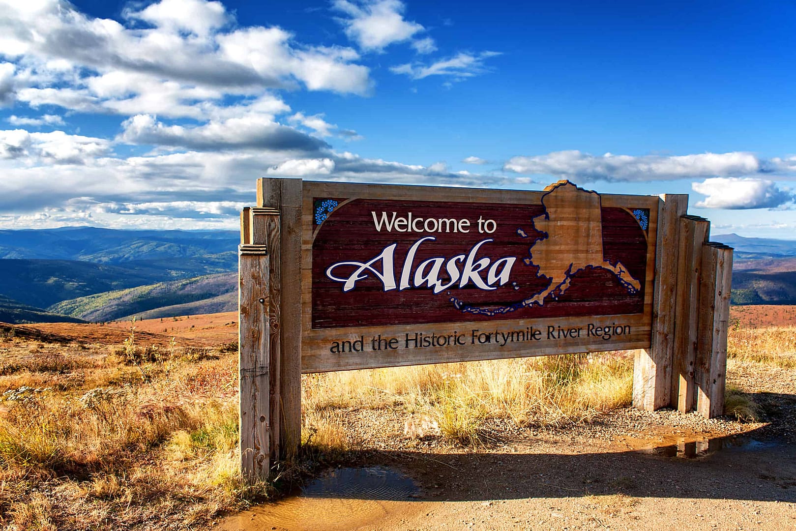Welcome to Alaska sign, celebrating the Great American Outdoors Act and the beauty of Alaska's outdoor economy.
