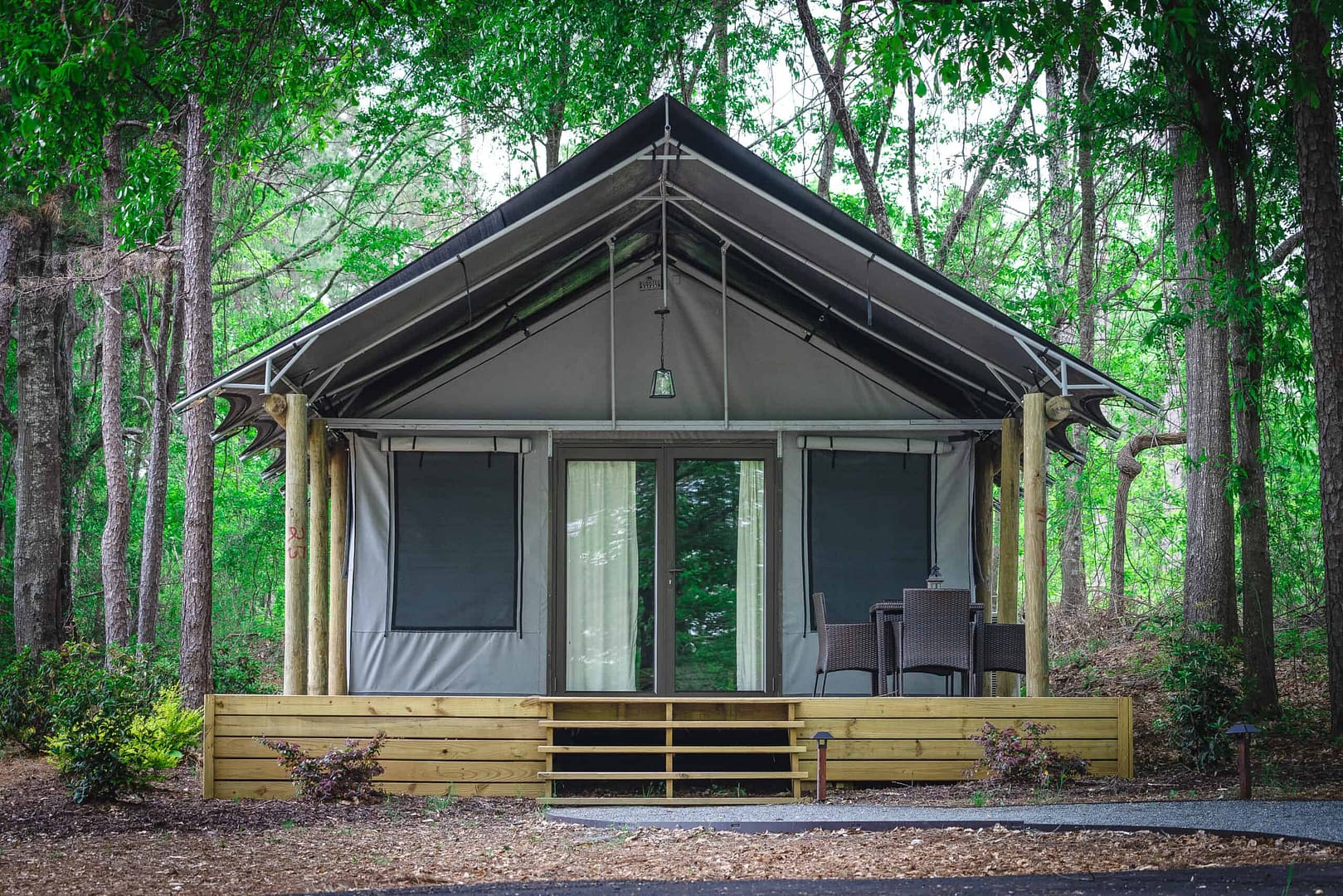 A luxury glamping lodging nestled in the tranquil woods of Pine Mountain RV Resort.