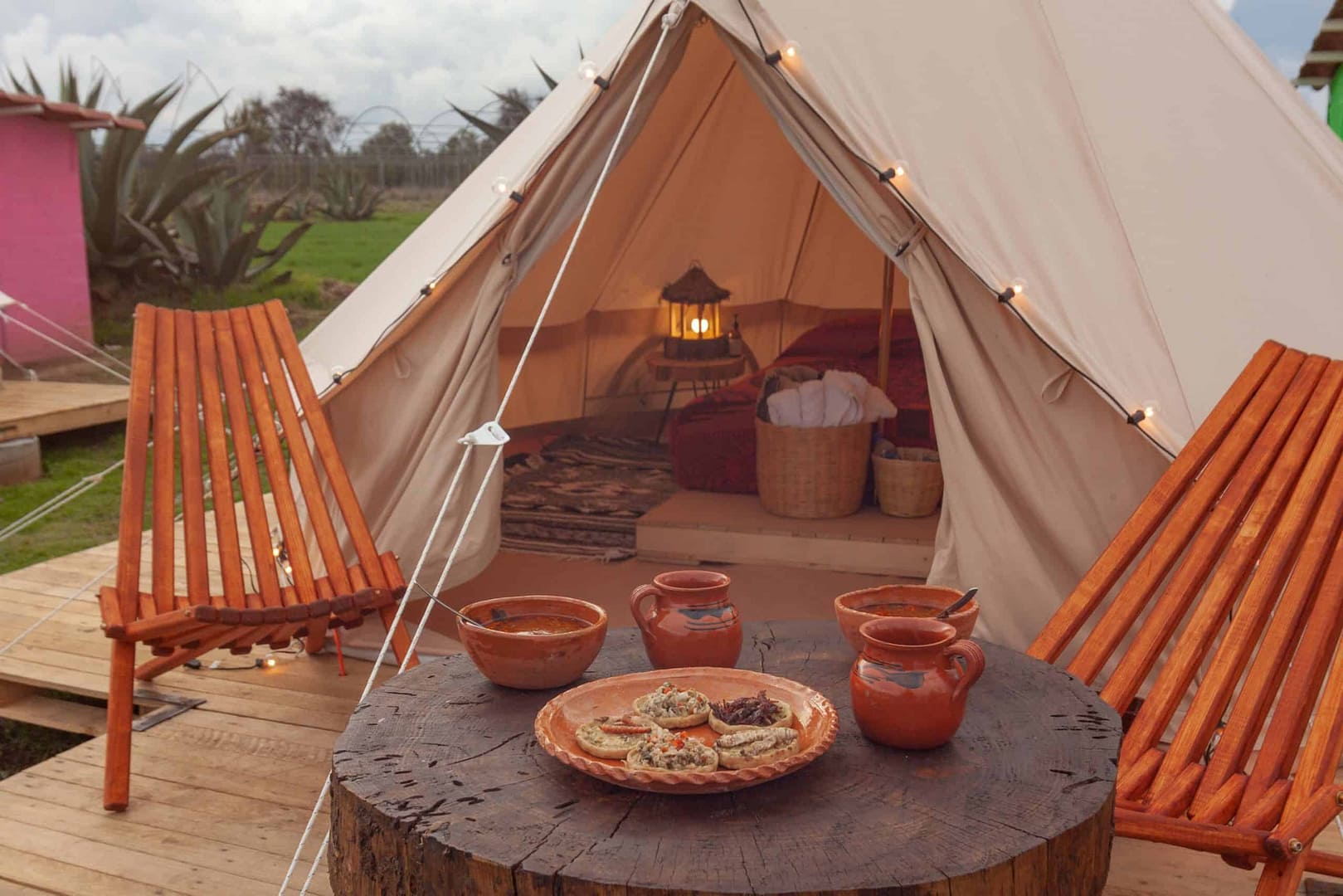 Breaking into Mexico's Glamping Scene with a teepee tent on a wooden deck.
