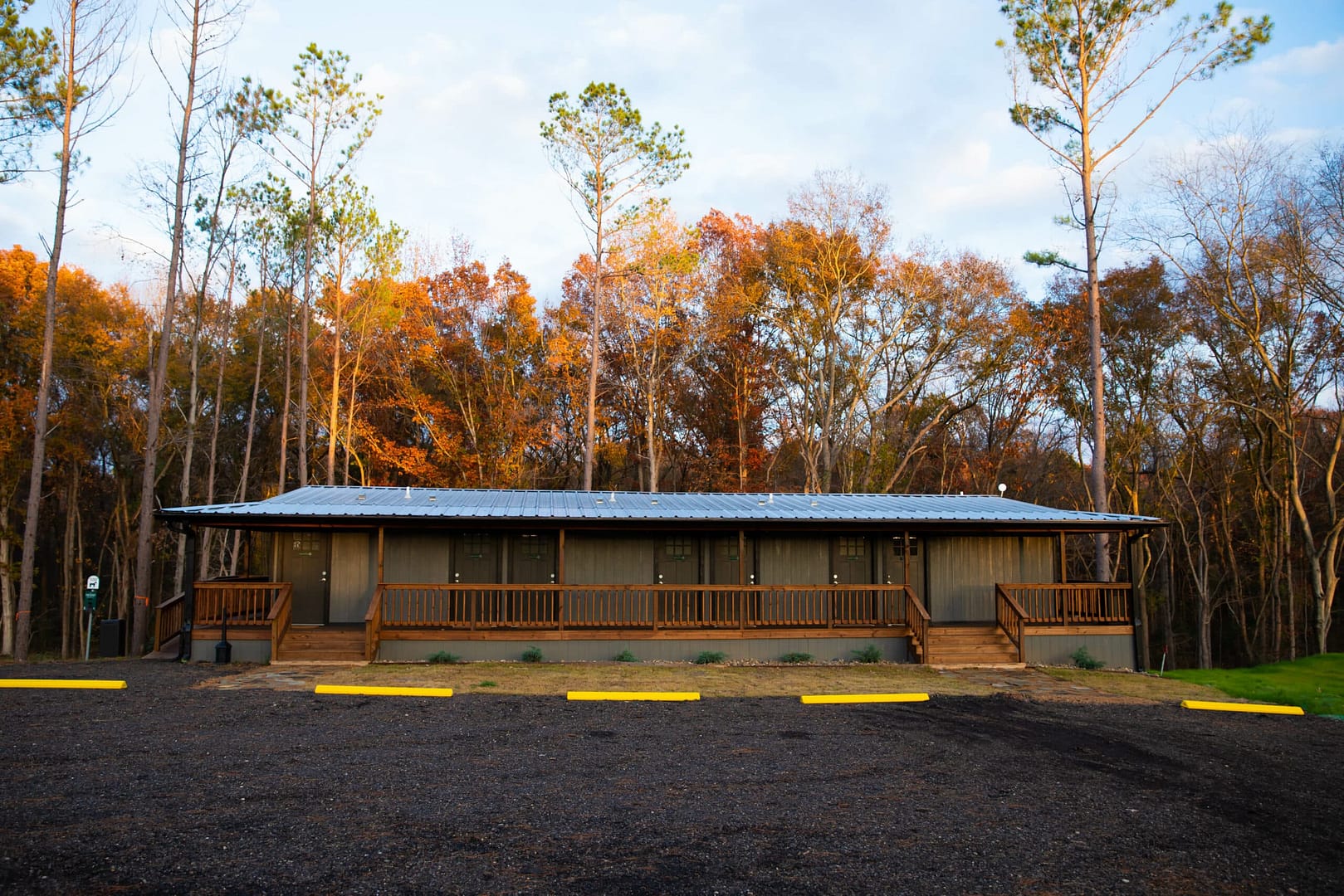 A TACO Award-winning cabin nestled in a serene wooded area, within the enchanting setting of Pines RV Cabin Resort.