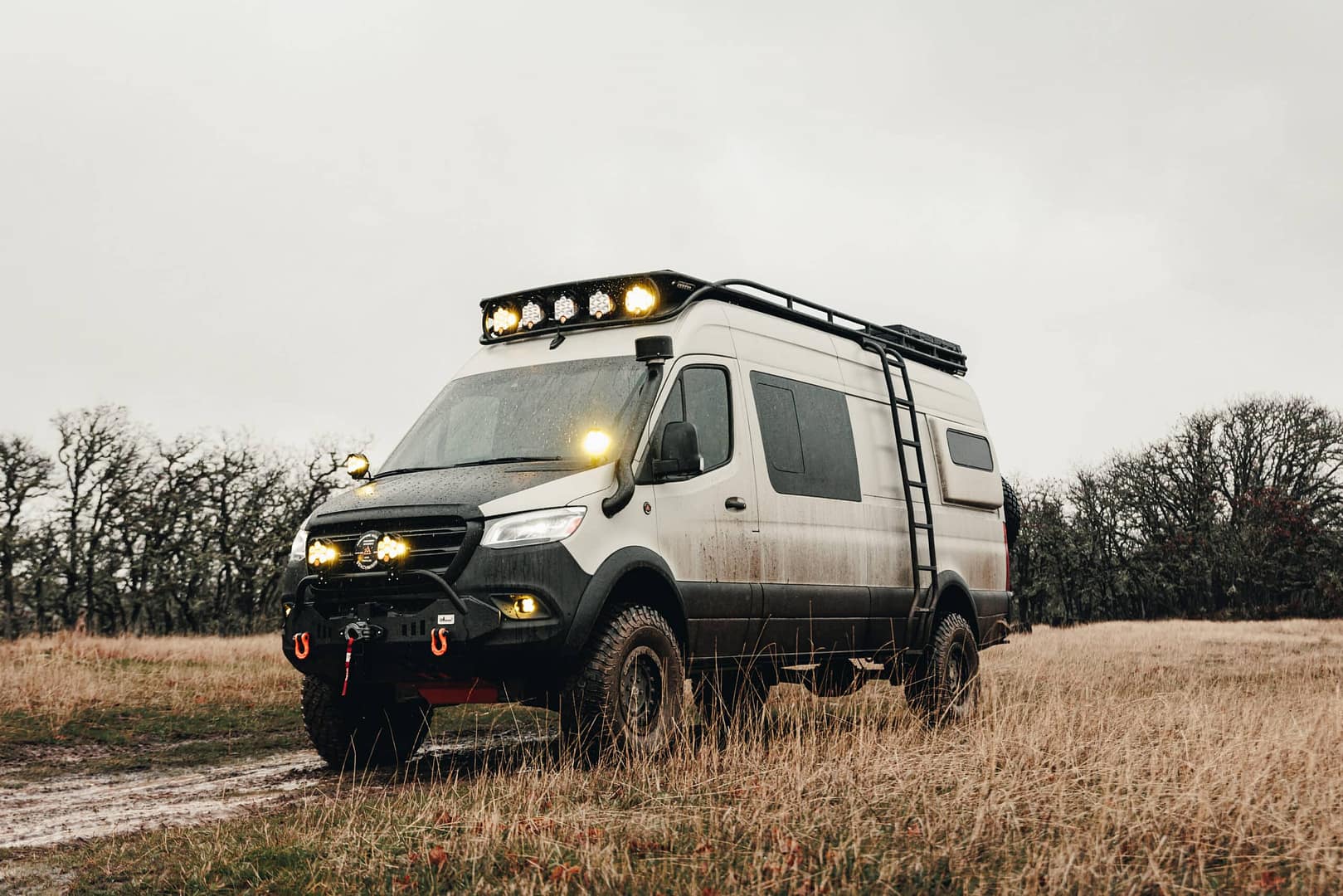 A U.S. Mercedes Sprinter van with the Allrad 170 conversion by Iglhaut parked in a field.