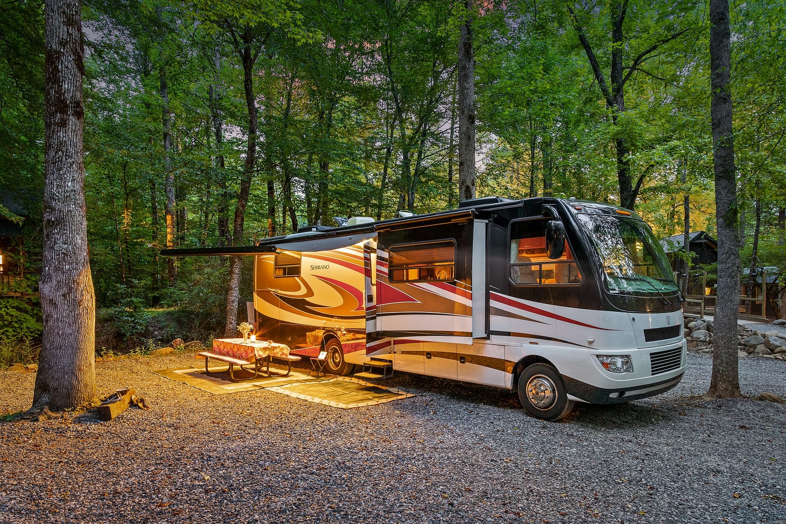 A camping rv nestled in a wooded area at Roamstead.