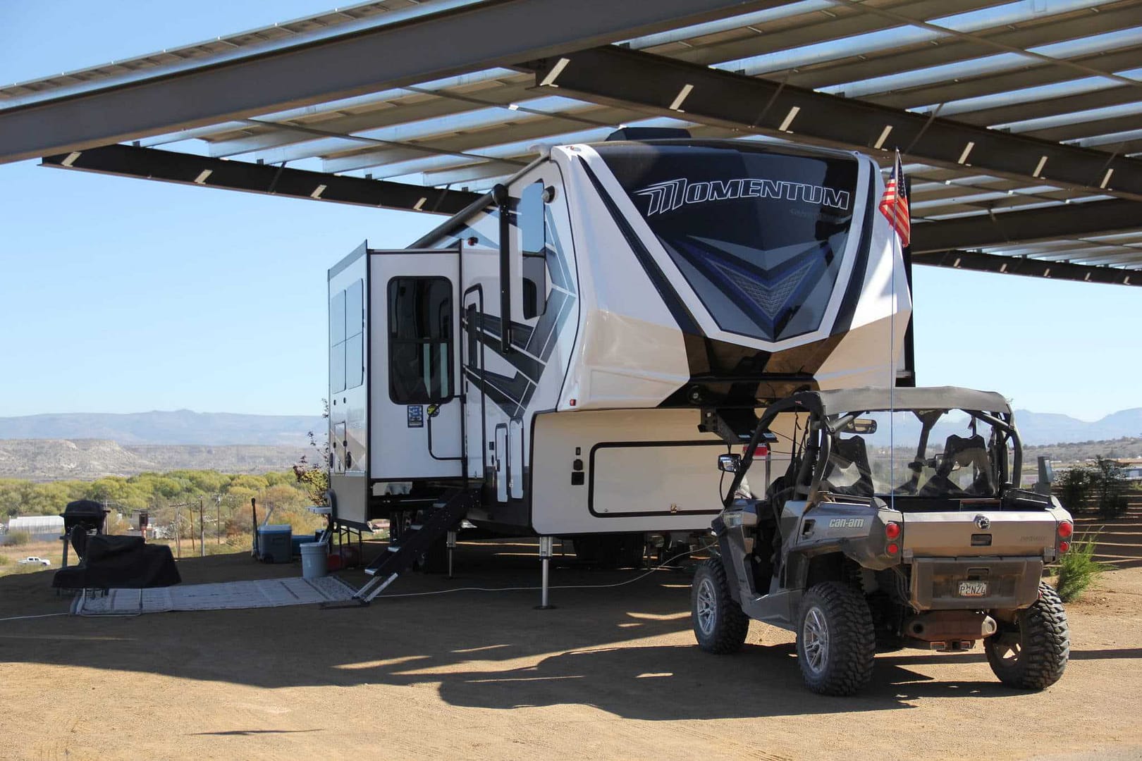Arizona LLC expands RV Retailer, showcasing an RV with an ATV parked in front.