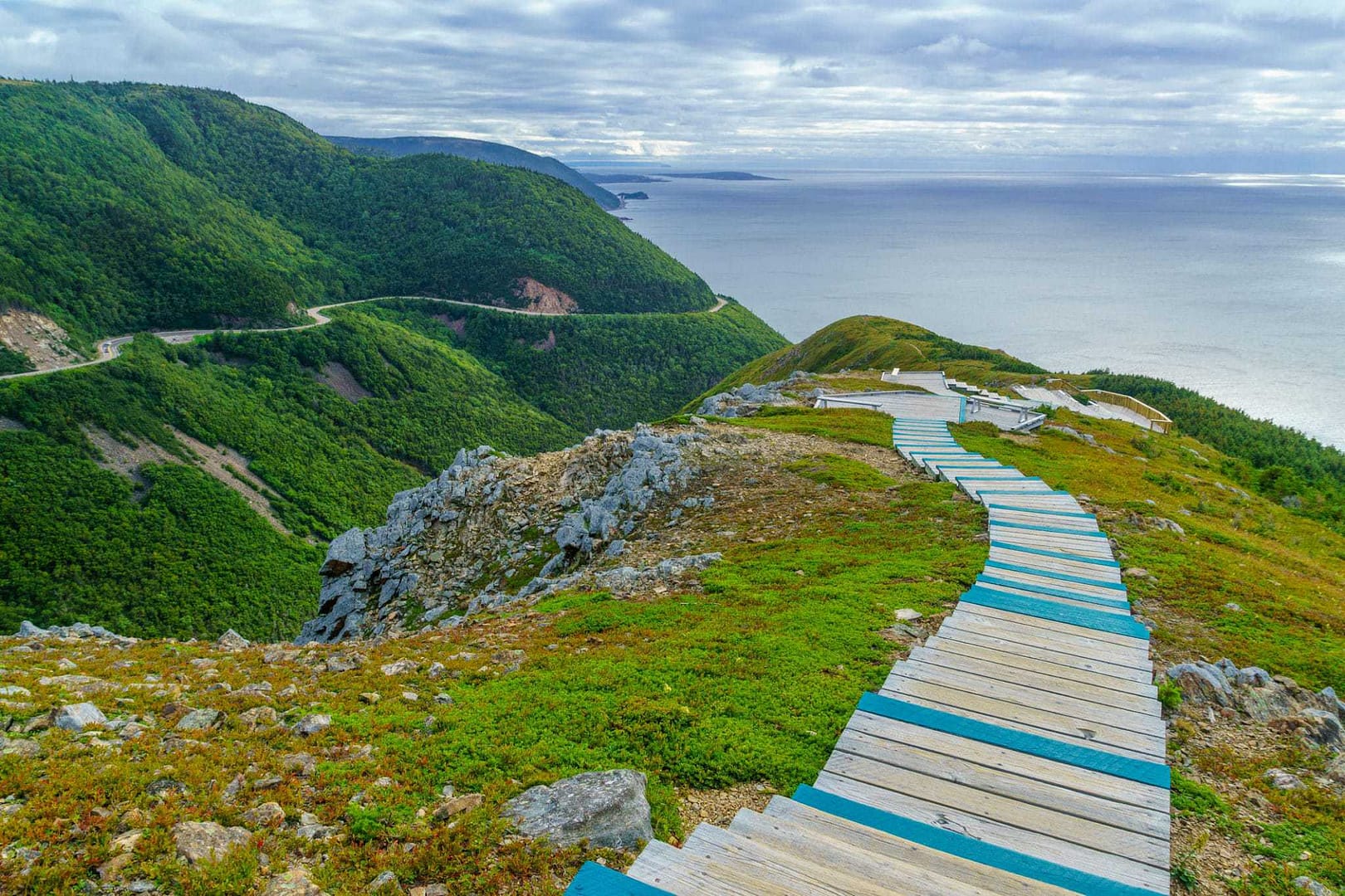 A wooden path leading to the ocean on a cliff in Nova Scotia.