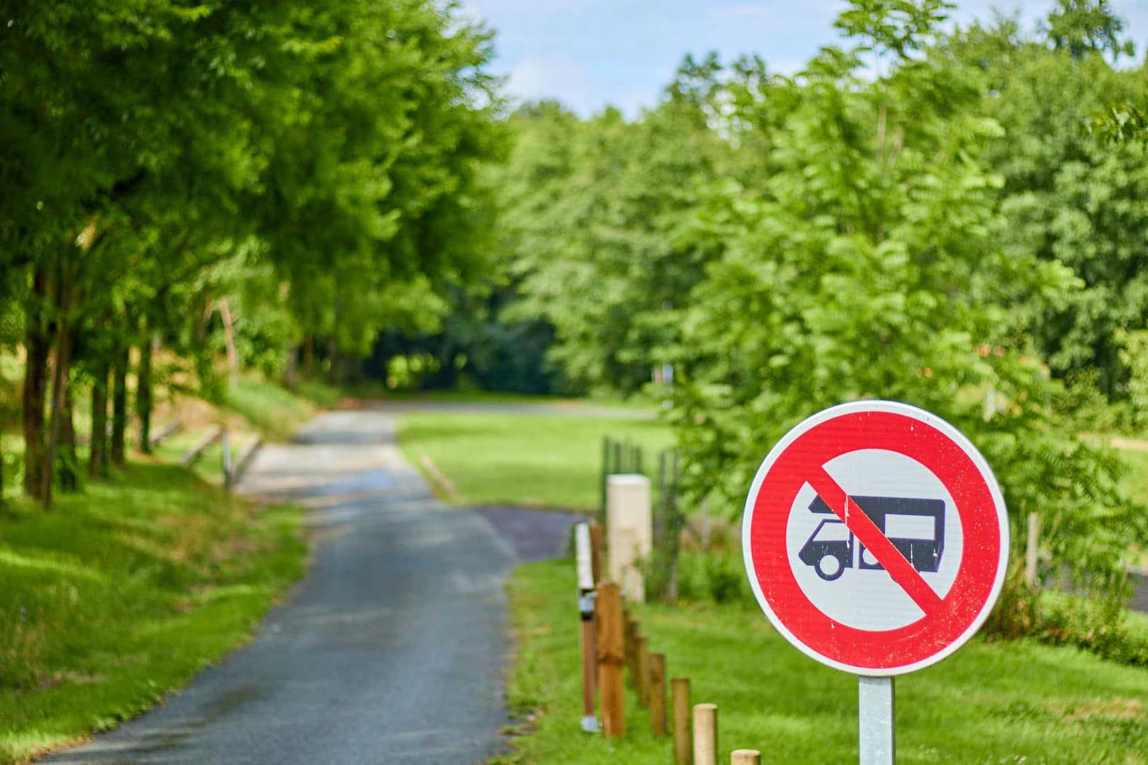 A "RV Ban" sign on the side of a road in a California town.