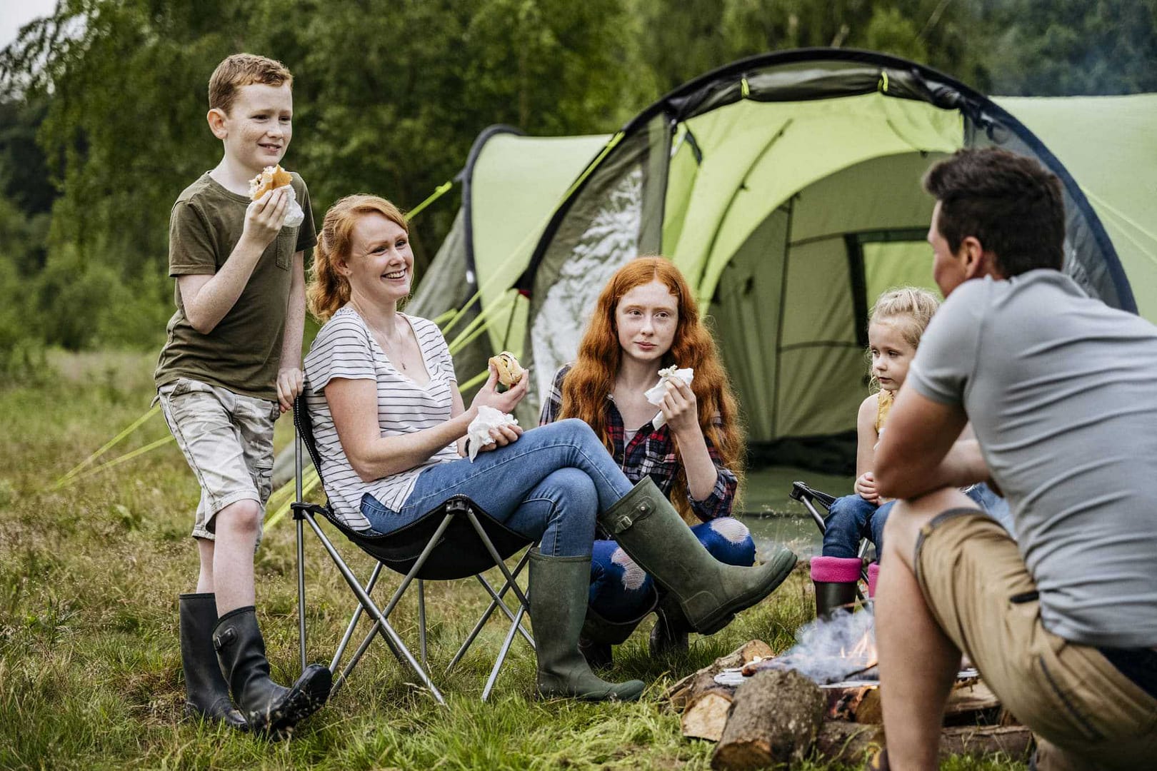 A Canadian family enjoys a cozy campfire during Camping Appreciation Weekend.