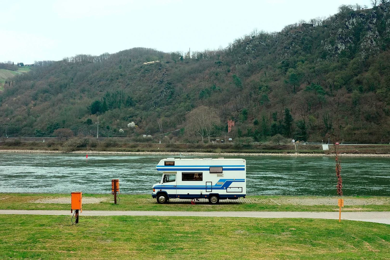 An Eberspächer rv parked on the side of a river.