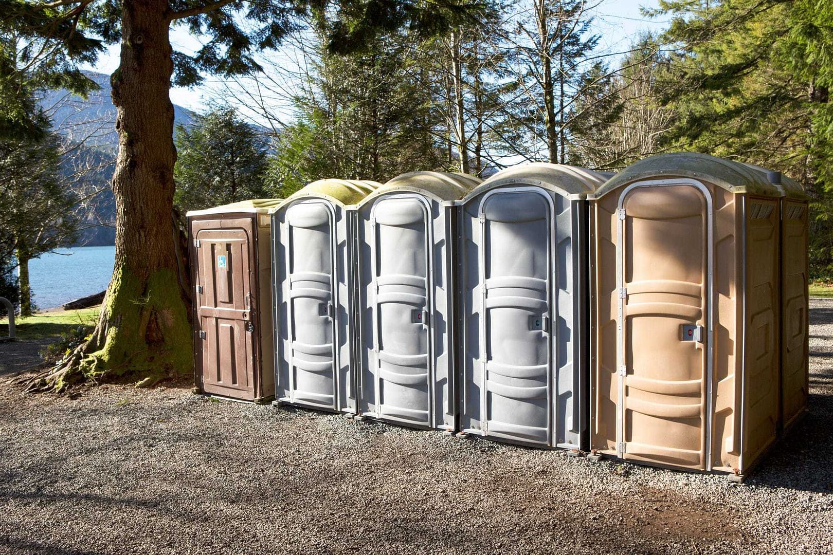 A row of Porta Potty toilets in an Alberta campground.