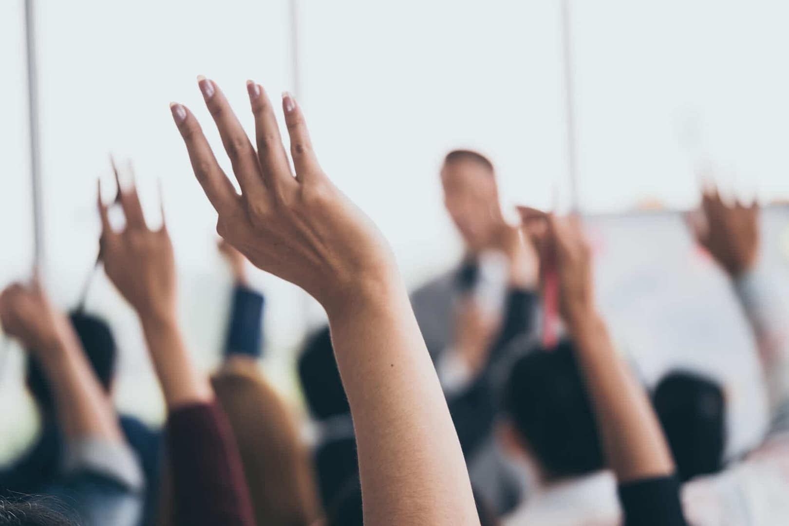 Residents of Tremont raising their hands in a meeting at the Campgrounds.