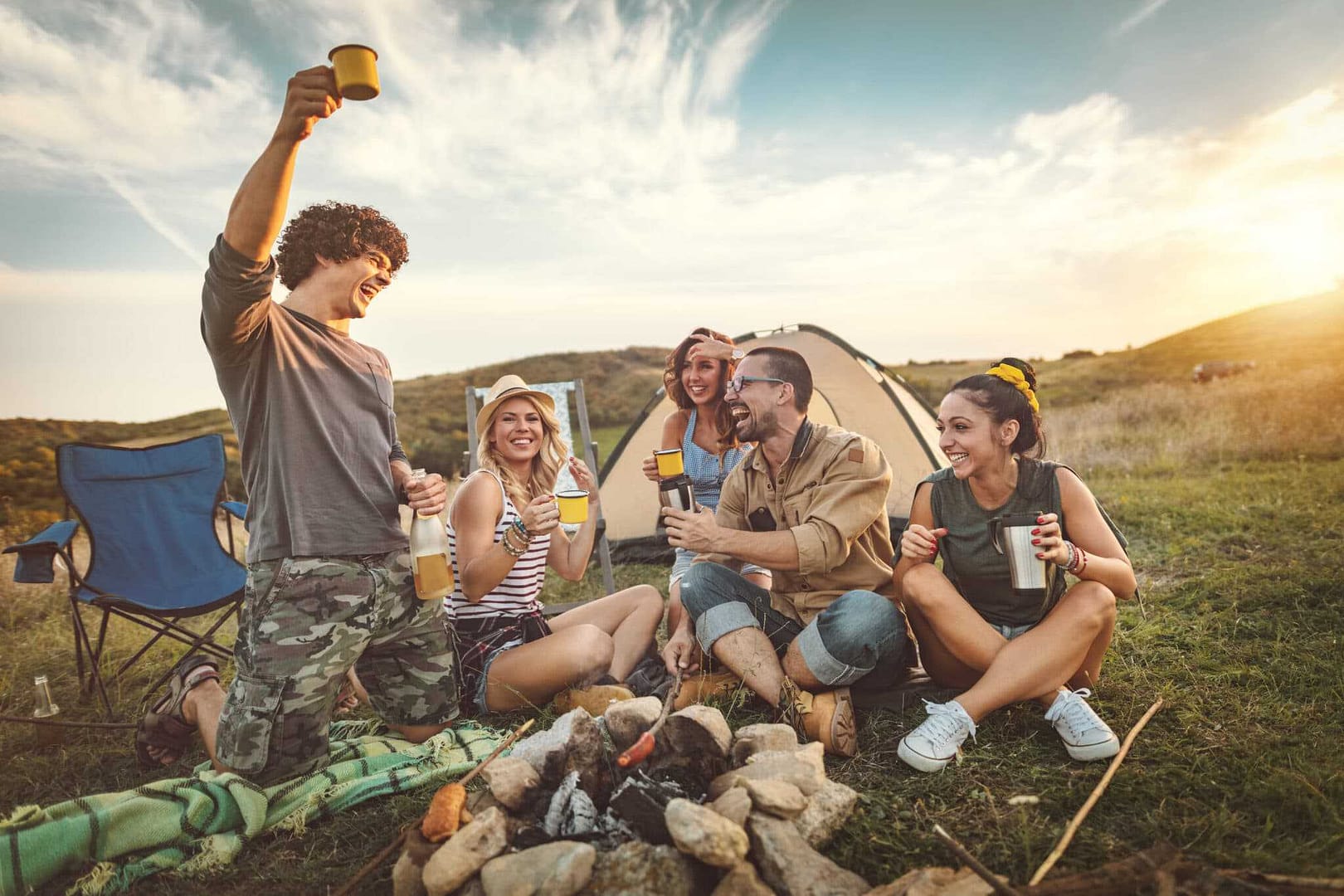 A group of friends sitting around a campfire in one of Missouri State Parks.