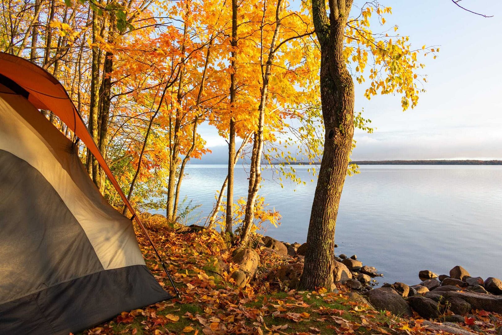 A tent is set up next to a Negaunee campground in the fall.