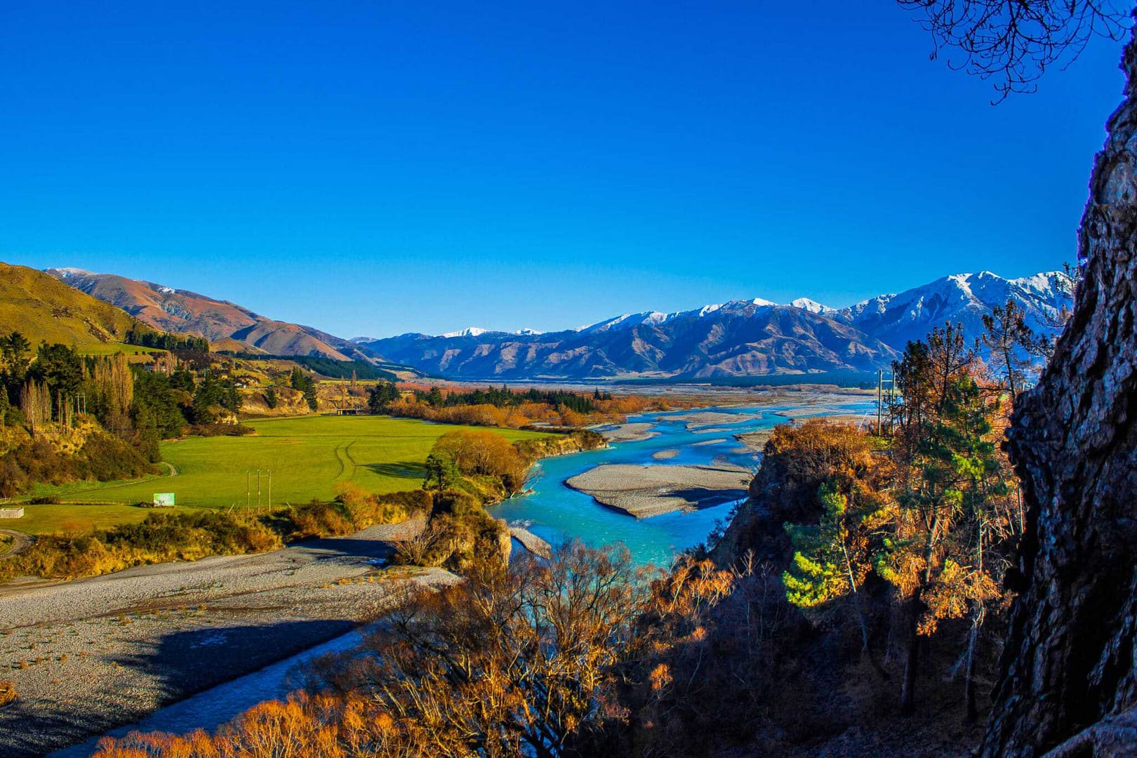 Official tourism view of the Hurunui river and mountains in New Zealand.