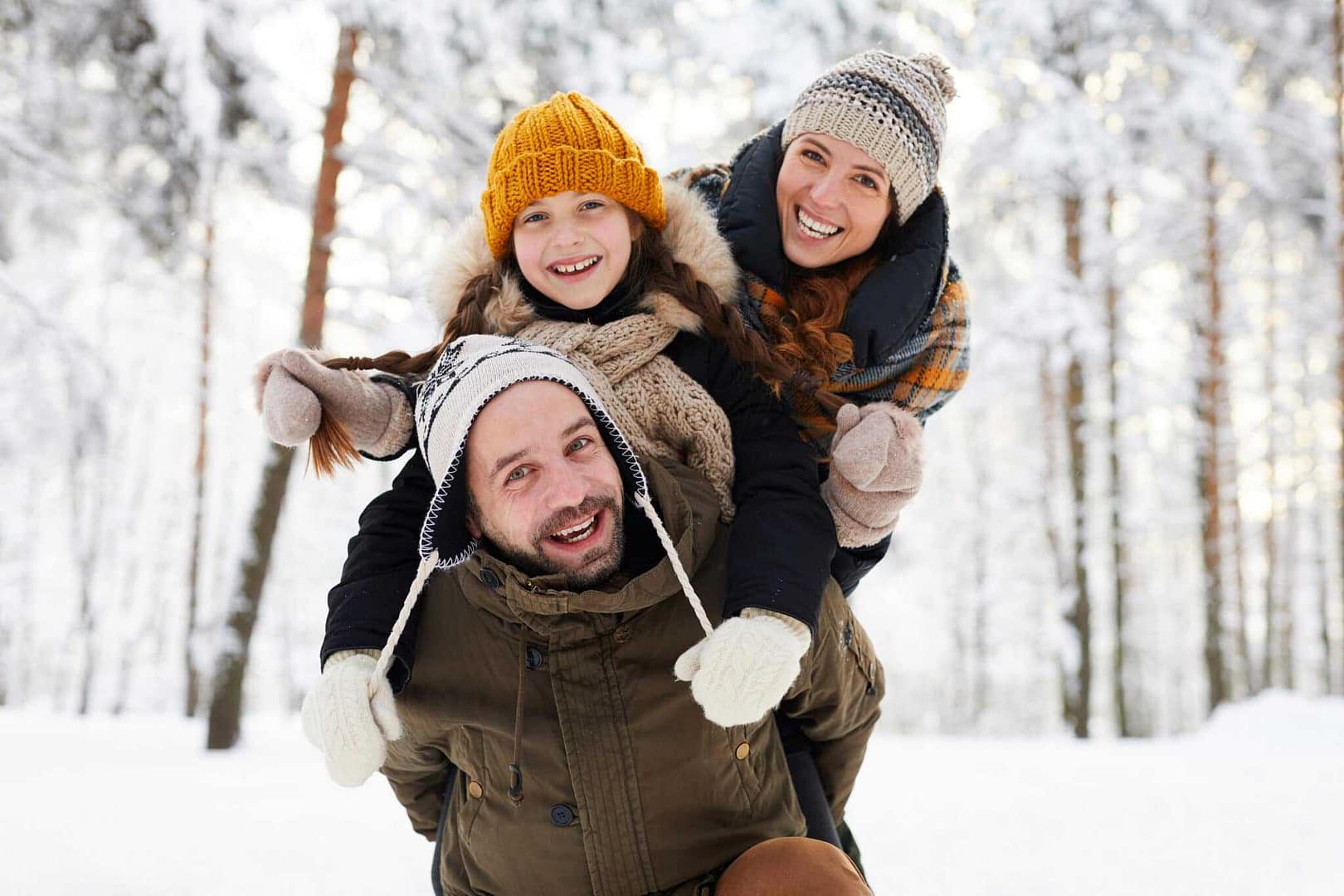 A family is having fun in the snow.