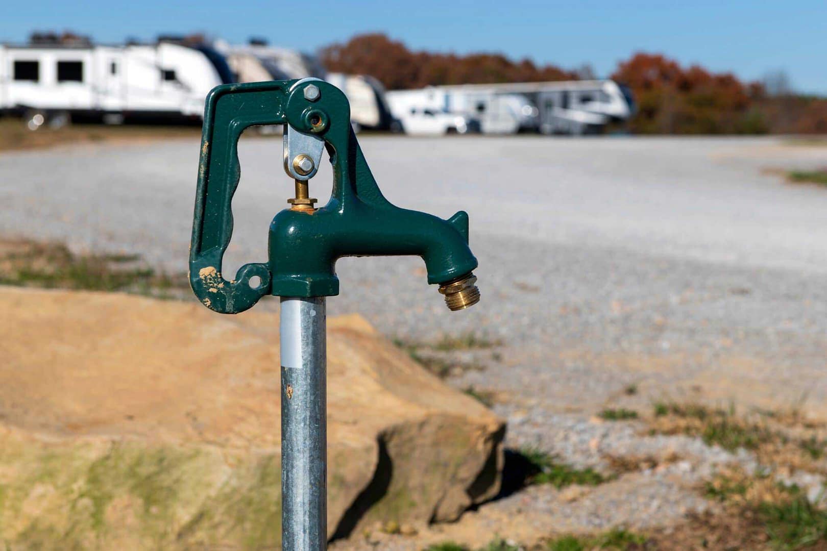 A water spigot in front of an RV park, providing access to groundwater for campers.
