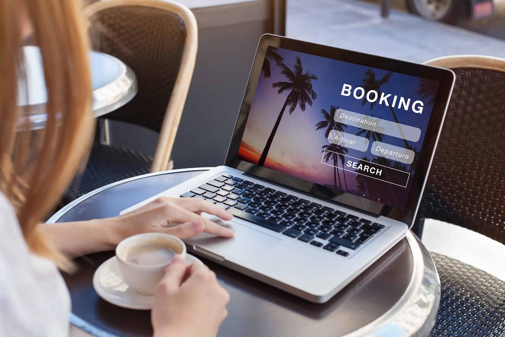 A woman is using a laptop to book reservations for Provincial Parks.