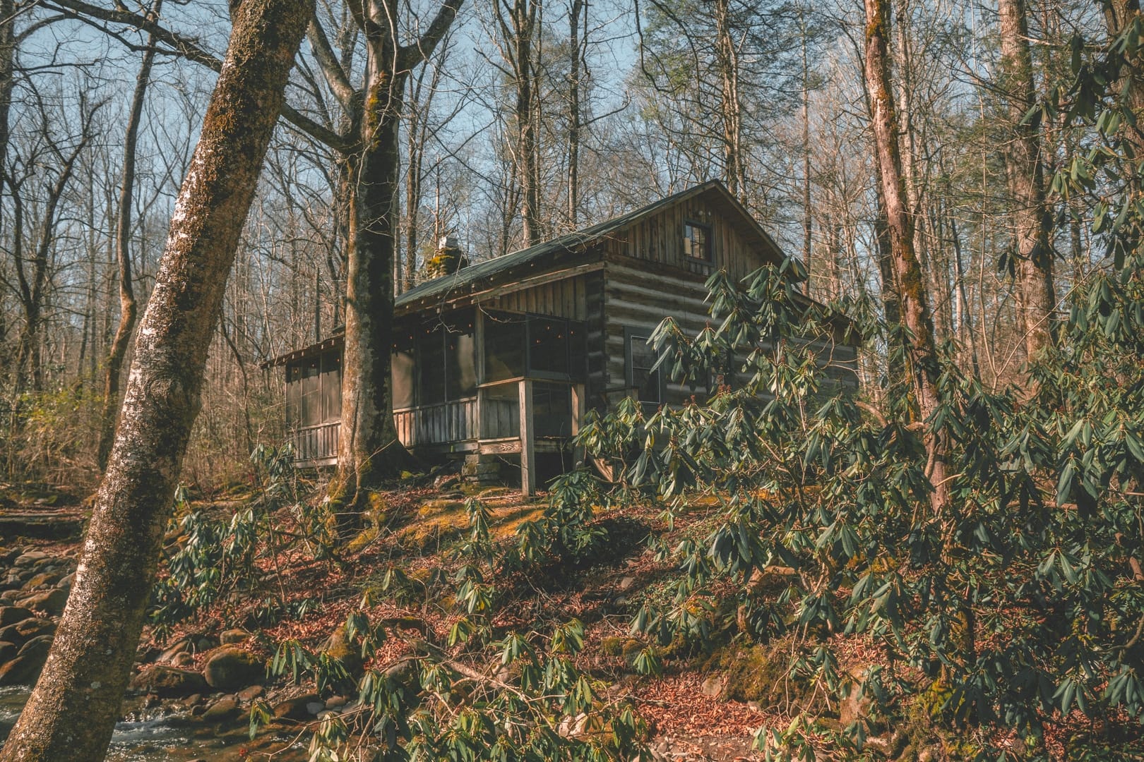 The Roamstead, a modernized campground brand, offers its first campsite location in the woods next to a stream.