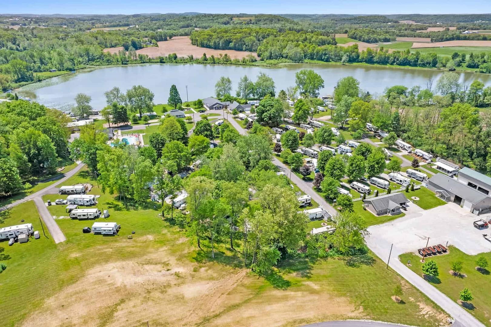 Long Lake Park, a campground near a lake, under new ownership opens up to an aerial view of the RV park.