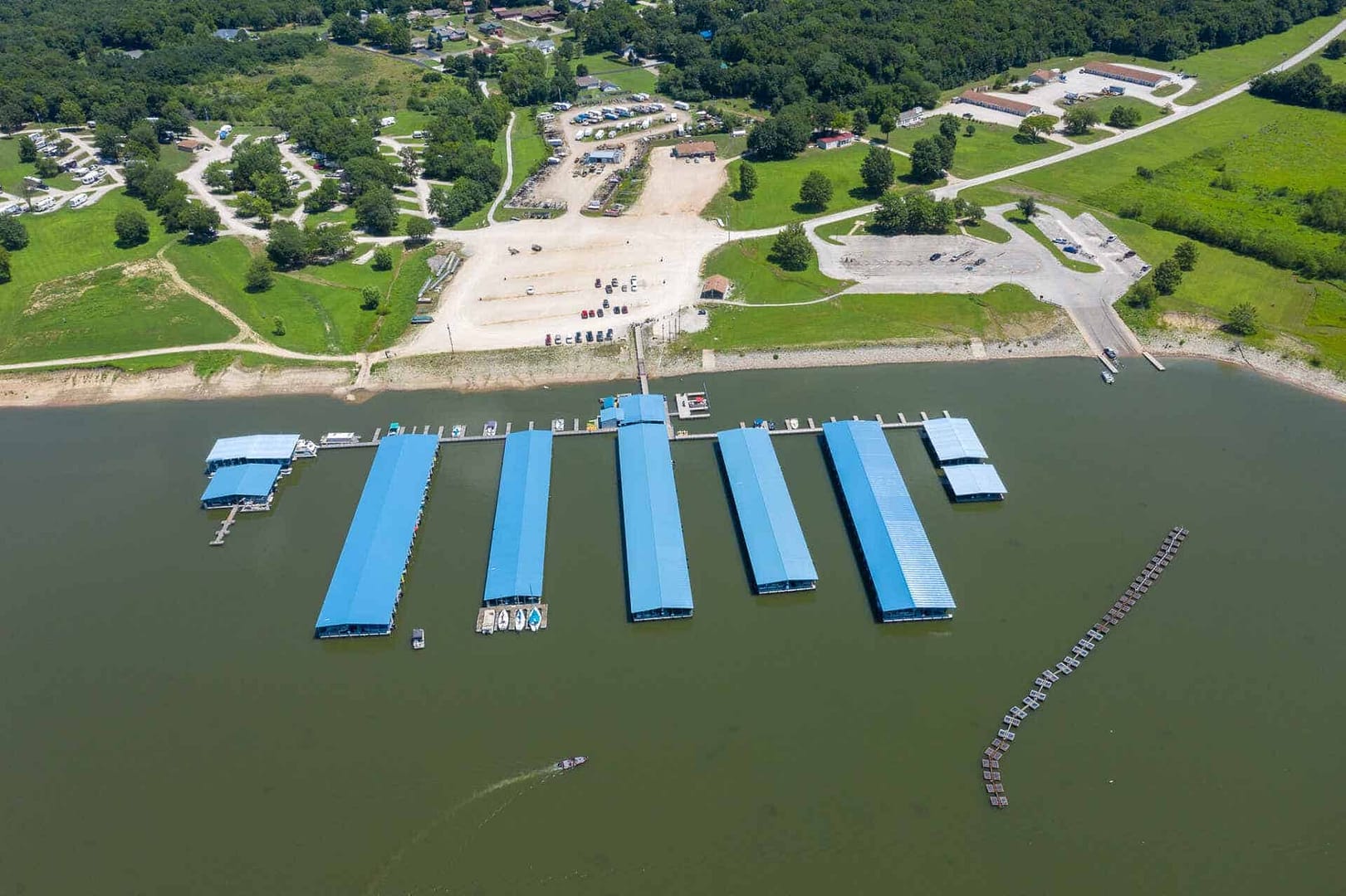 An aerial view of BEYONDER Camp, an outdoor Experiences on a lake.