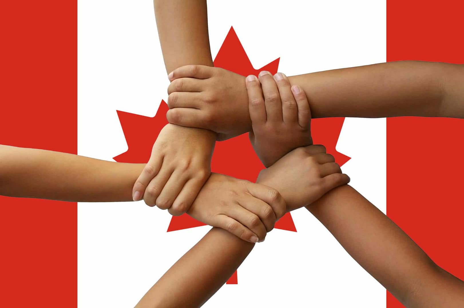 A group of people holding hands together in front of a Jasper National Park.
