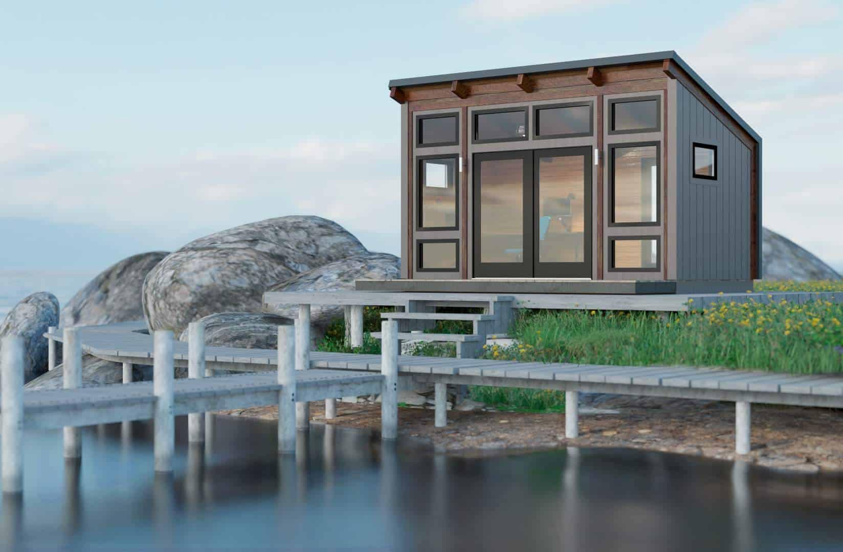 A TimberHut sits on a dock next to the water.