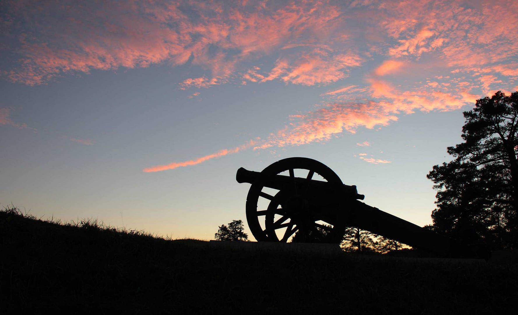 A cannon on a hill at sunset in Colonial National Historical Park.