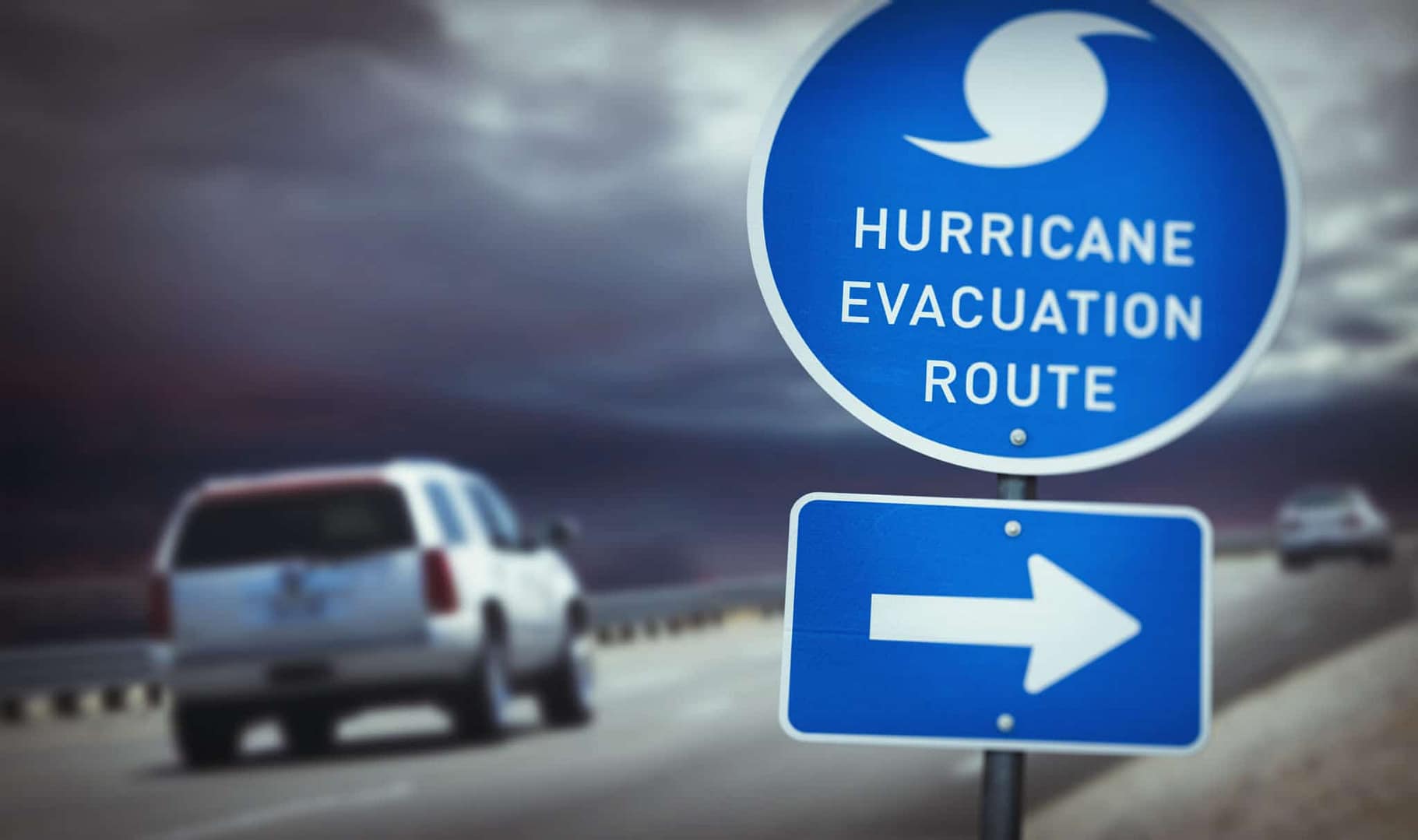 A sign that says hurricane evacuation route in front of a Louisiana Park.