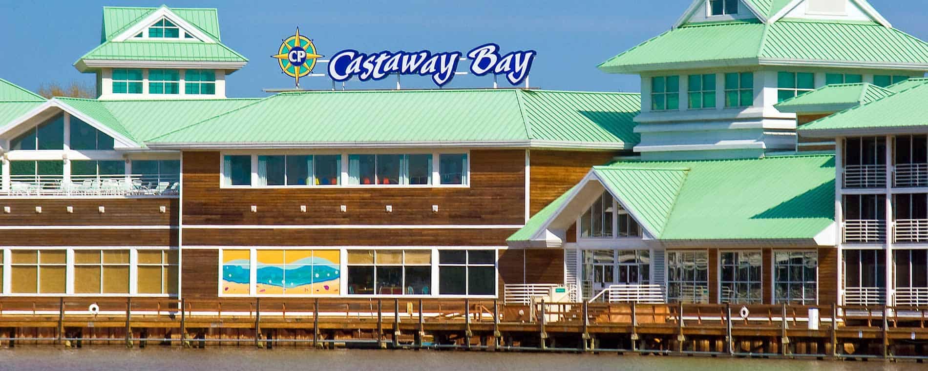 An investment at Cedar Point to improve guest experience by adding a building with a green roof next to a body of water.