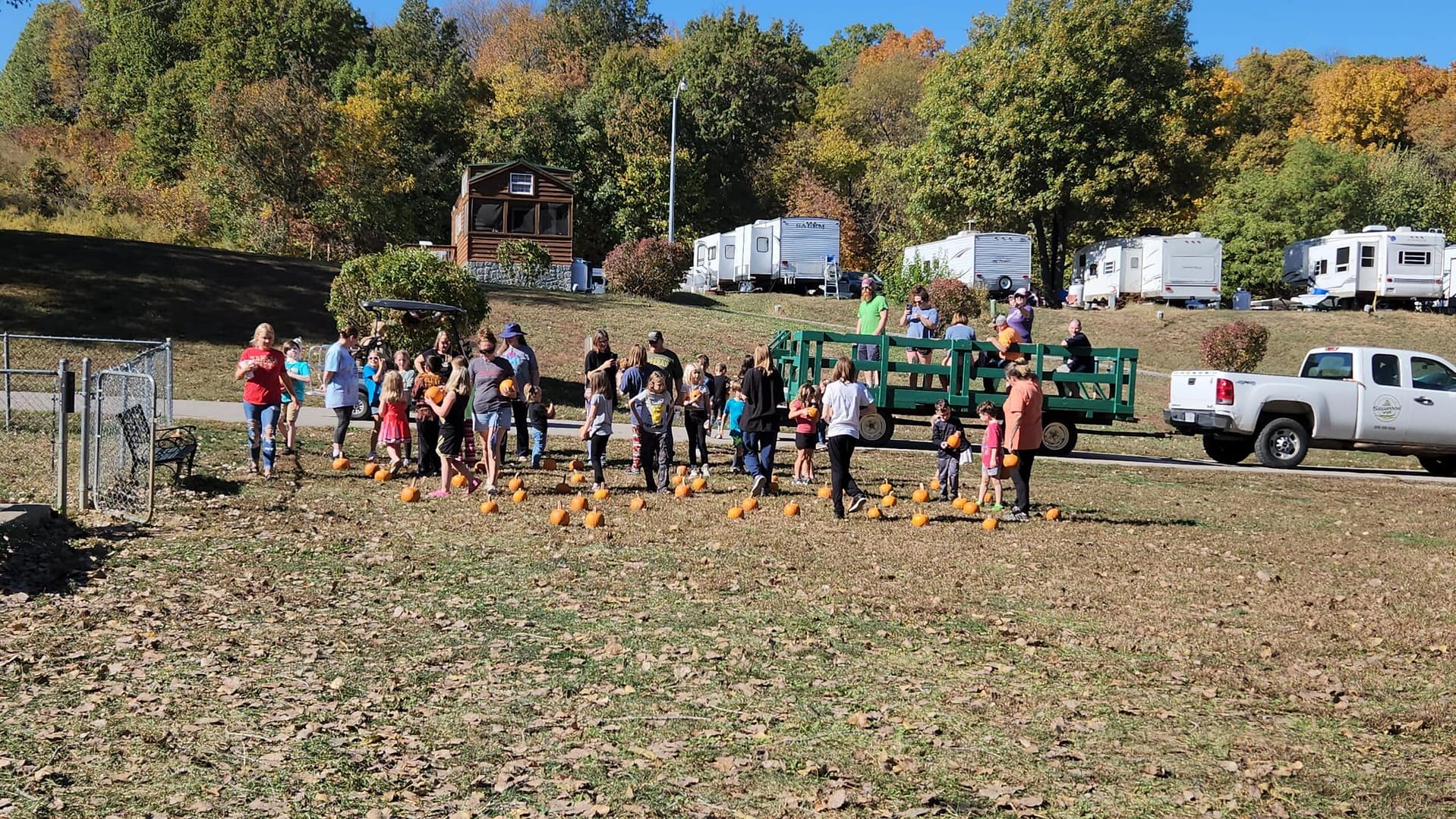 A group of people gathered amidst the October festivities at Basswood Resort.