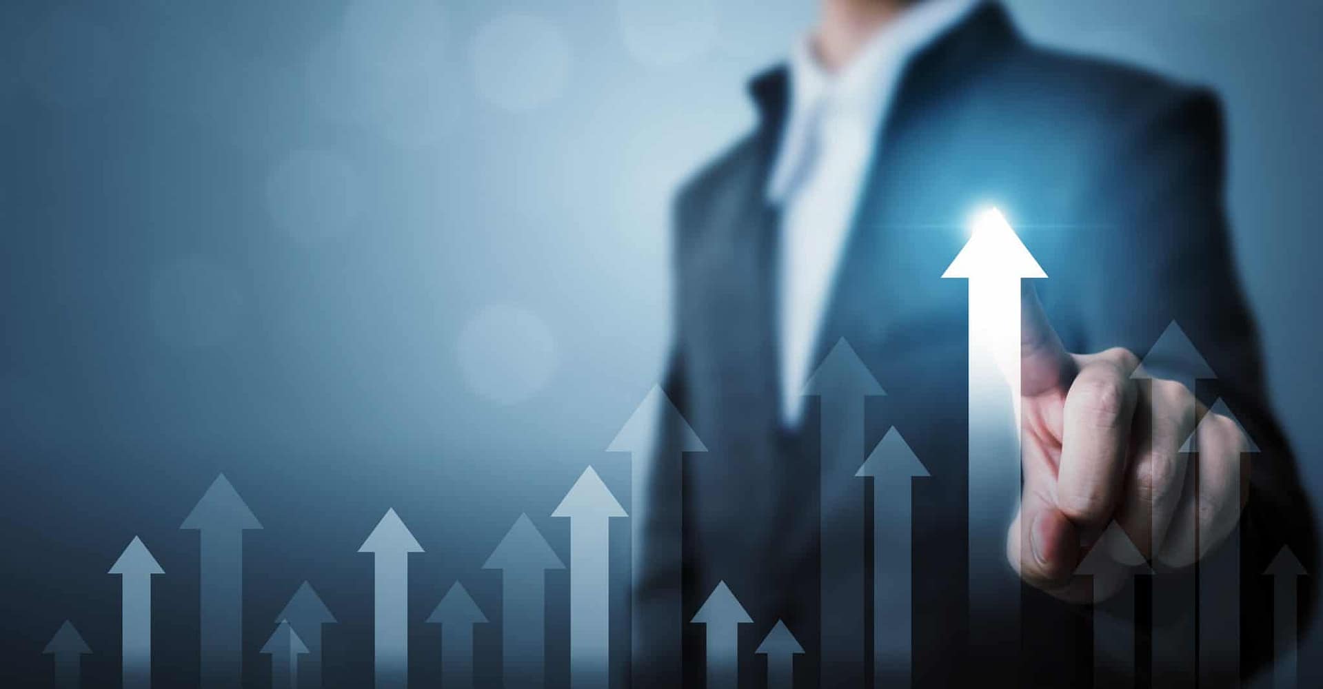 A businessman is pointing at an upward arrow in the Global Camping and Caravanning Market.