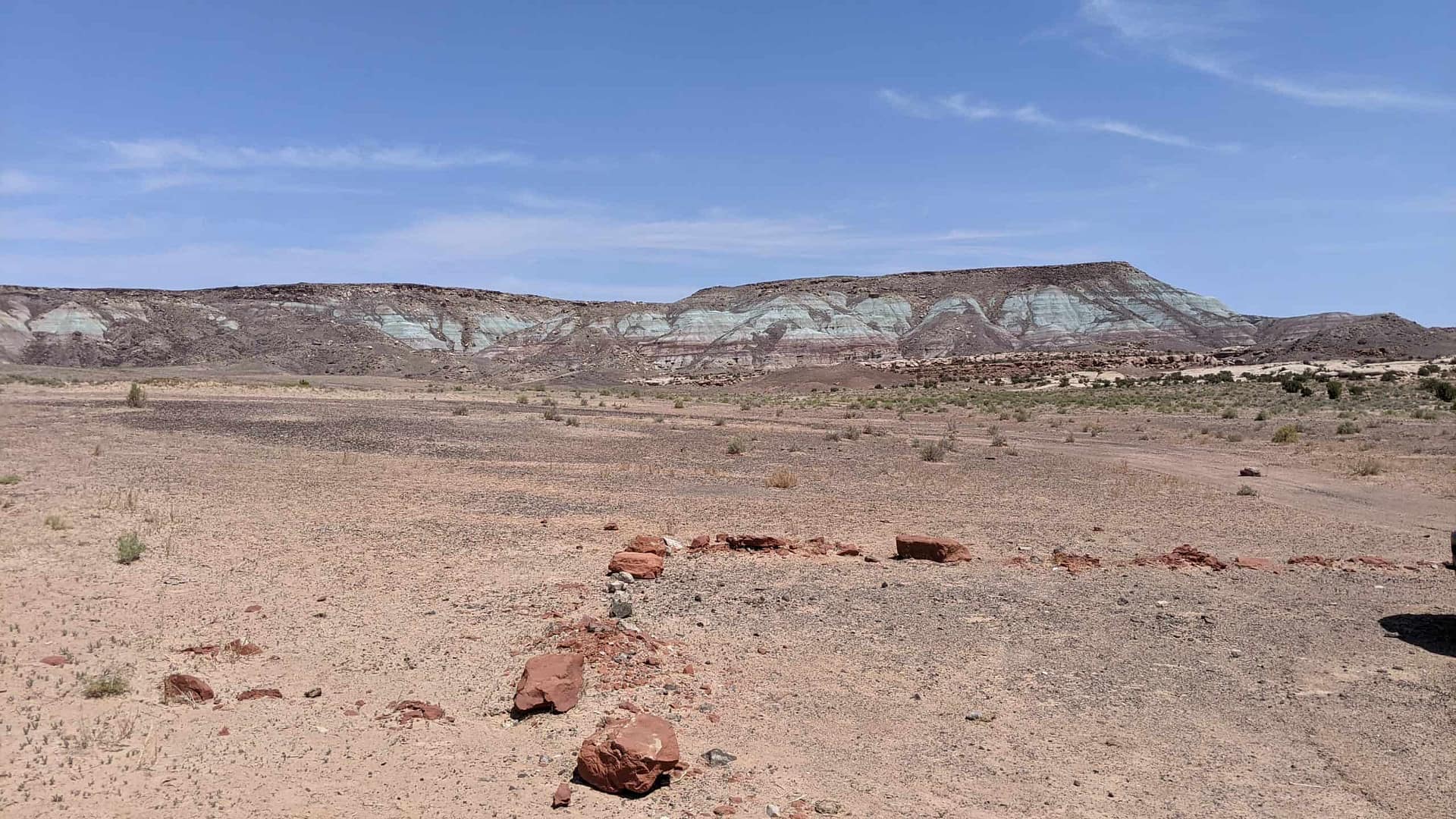 A jeep is parked overnight in the middle of Utahraptor State Park.