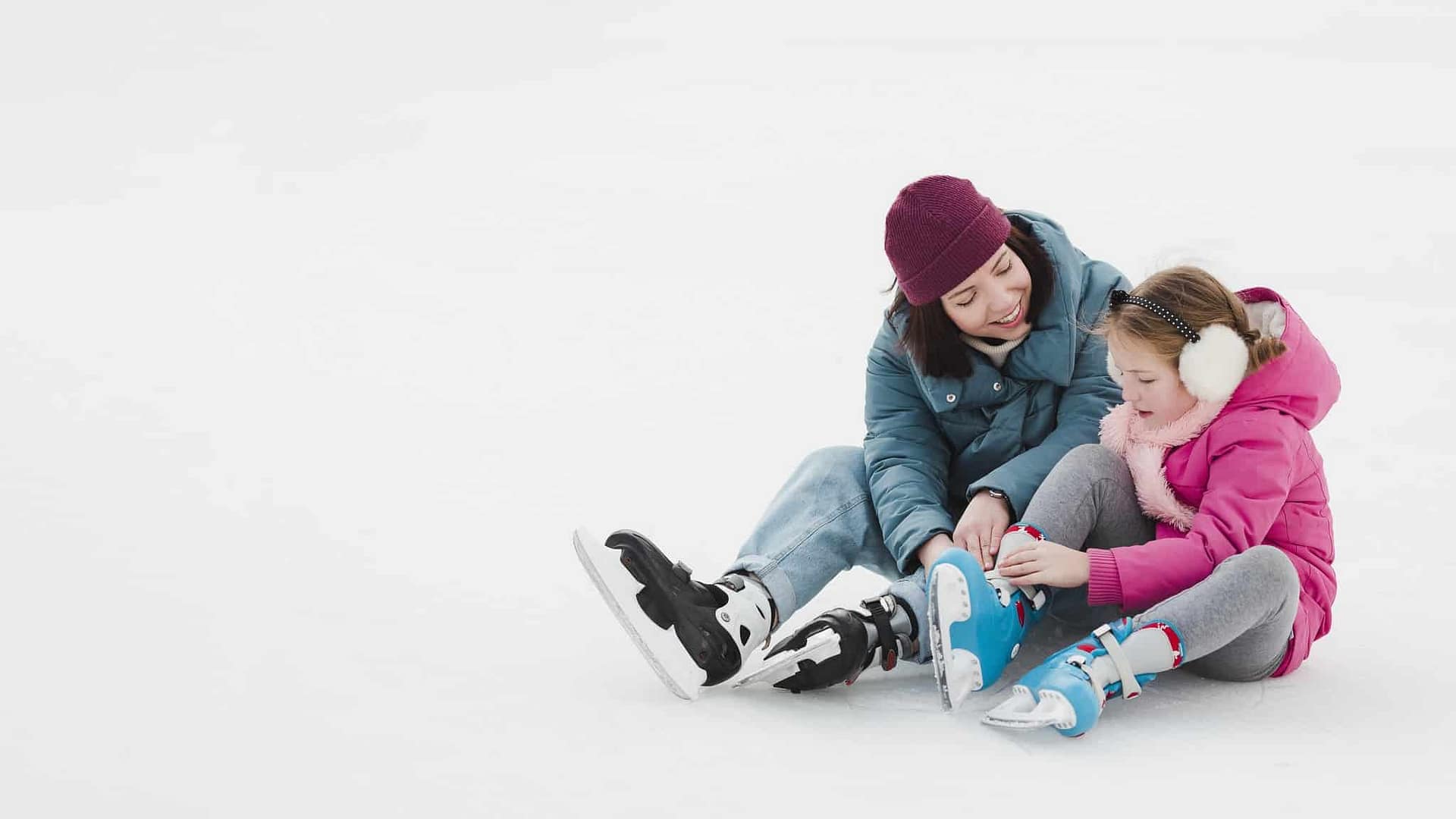 A mother and daughter enjoying a winter day at the Okotoks Lions Campground skating trail.