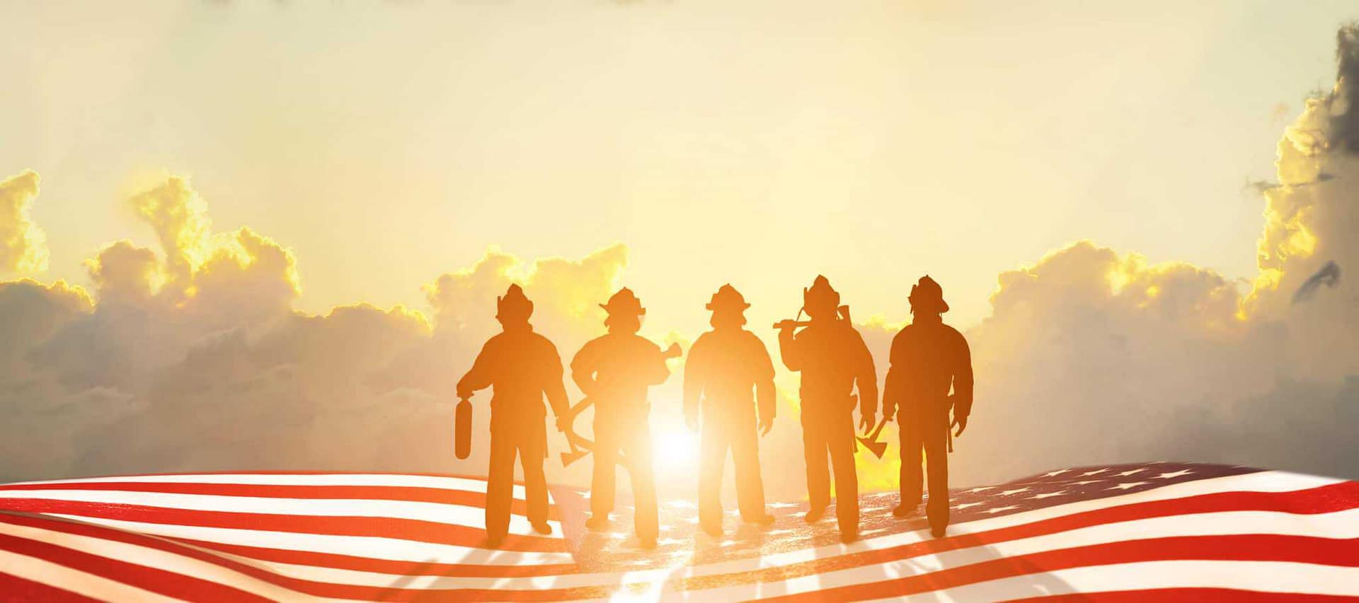 Fire Team standing in front of an American flag amidst the Caldor Fire in California.