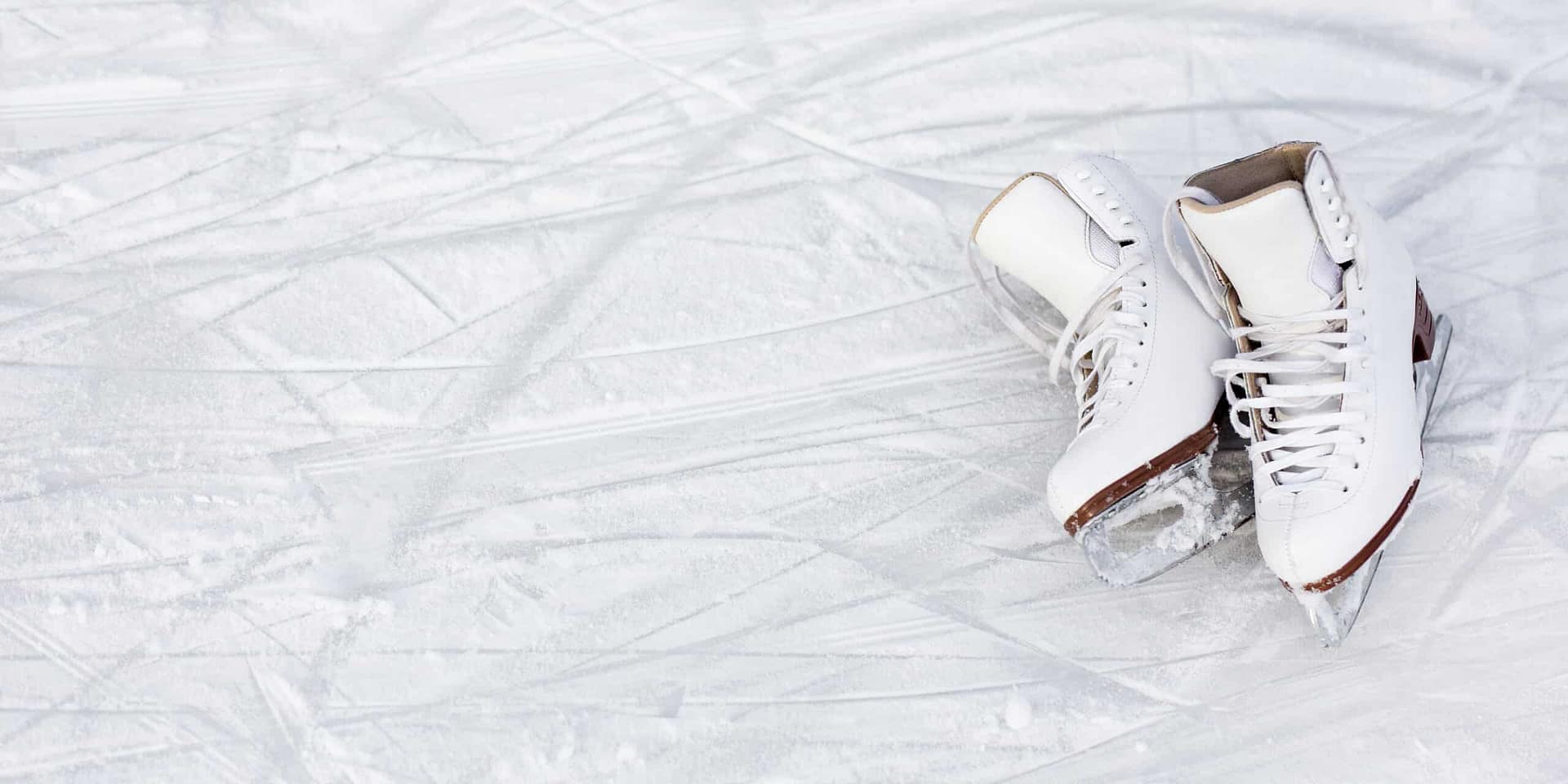 A pair of white ice skates gliding gracefully along the Arrowhead Provincial Park Ice Skating Trail during the 2024 season.