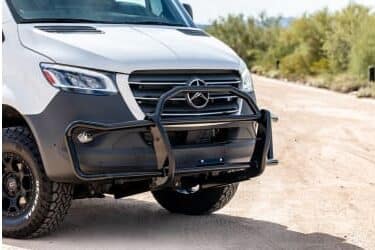 The white Mercedes-Benz Sprinter featuring a SolidShield front bumper.
