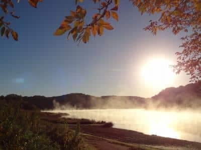 Mist rising from a river in the early morning at White Mound County Campground, Sauk County.